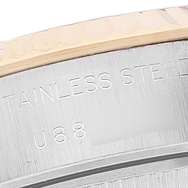 This close-up image shows the case side of a Rolex Datejust 69173 Women
s Steel and Gold (two tone) Mother of Pearl Dial 69173 Women
s Steel and Gold (two tone) Mother of Pearl Dial watch, highlighting the stainless steel engraving.