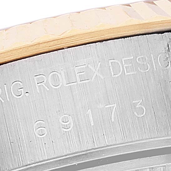 The image shows a close-up angle of the case side of a Rolex Datejust 69173 Women
s Steel and Gold (two tone) Mother of Pearl Dial 69173 Women
s Steel and Gold (two tone) Mother of Pearl Dial, displaying part of the model number and branding.