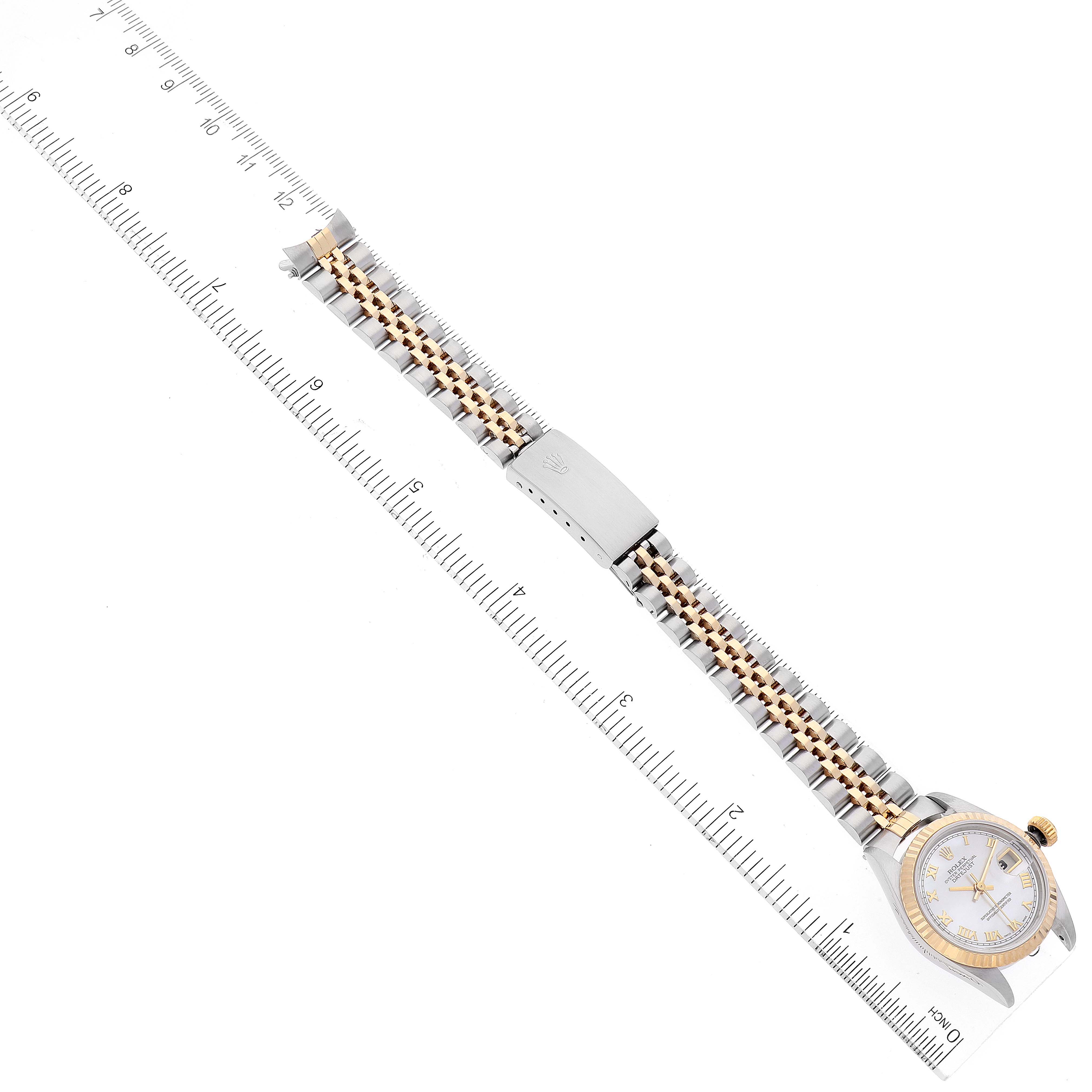 This image shows a top-down view of a Rolex Datejust 69173 Women
s Steel and Gold (two tone) Mother of Pearl Dial 69173 Women
s Steel and Gold (two tone) Mother of Pearl Dial watch, highlighting its bracelet, clasp, and dial.
