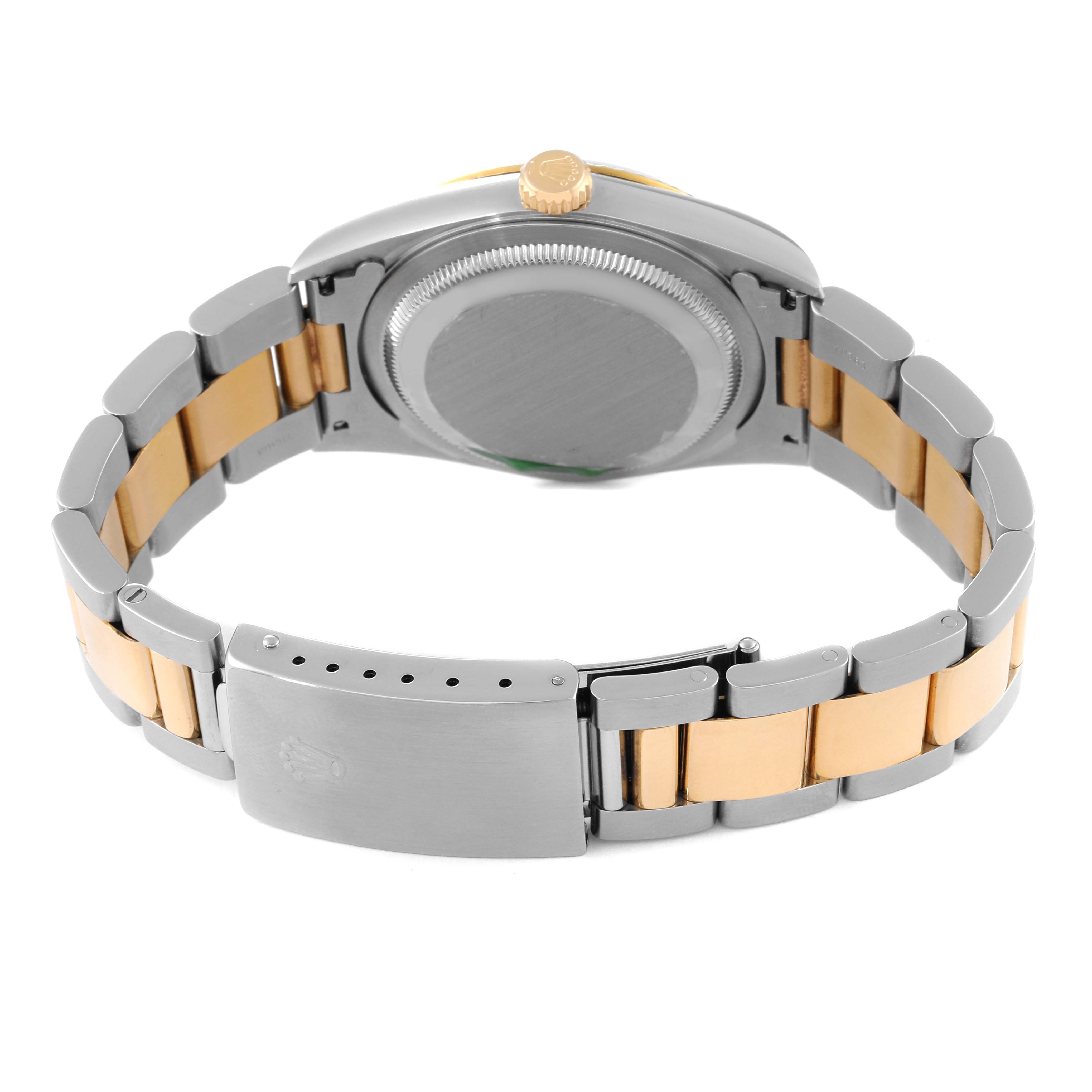 The image shows the back view of a Rolex Datejust 16233 Men's Steel and Gold (two tone) Blue Dial 16233 Men's Steel and Gold (two tone) Blue Dial watch, highlighting its case back and two-tone metal bracelet with a clasp.