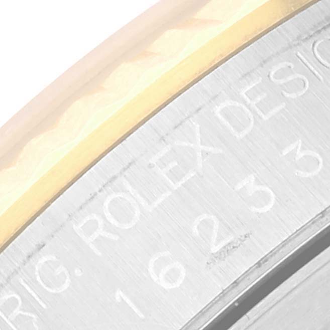 The image shows a close-up of the bezel and case of a Rolex Datejust 16233 Men's Steel and Gold (two tone) Blue Dial 16233 Men's Steel and Gold (two tone) Blue Dial watch, highlighting the model number engraving.