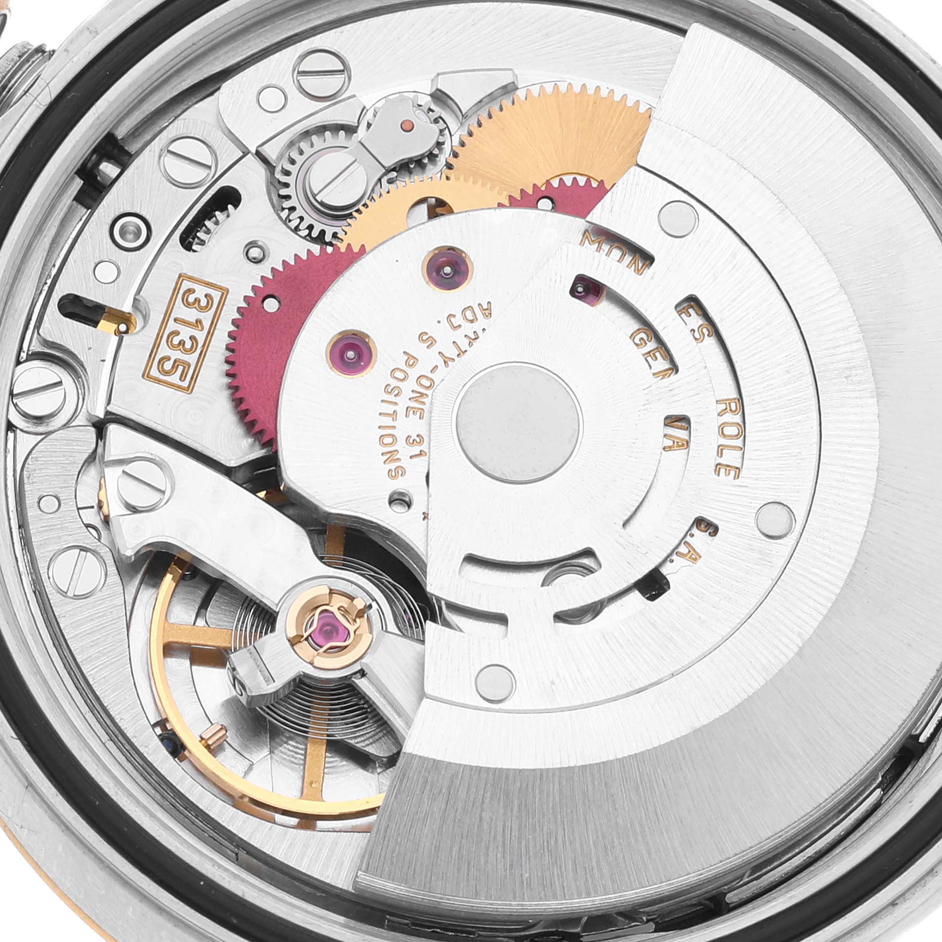 This image shows the internal mechanical movement of a Rolex Datejust 16233 Men's Steel and Gold (two tone) Blue Dial 16233 Men's Steel and Gold (two tone) Blue Dial, revealing gears and the rotor.