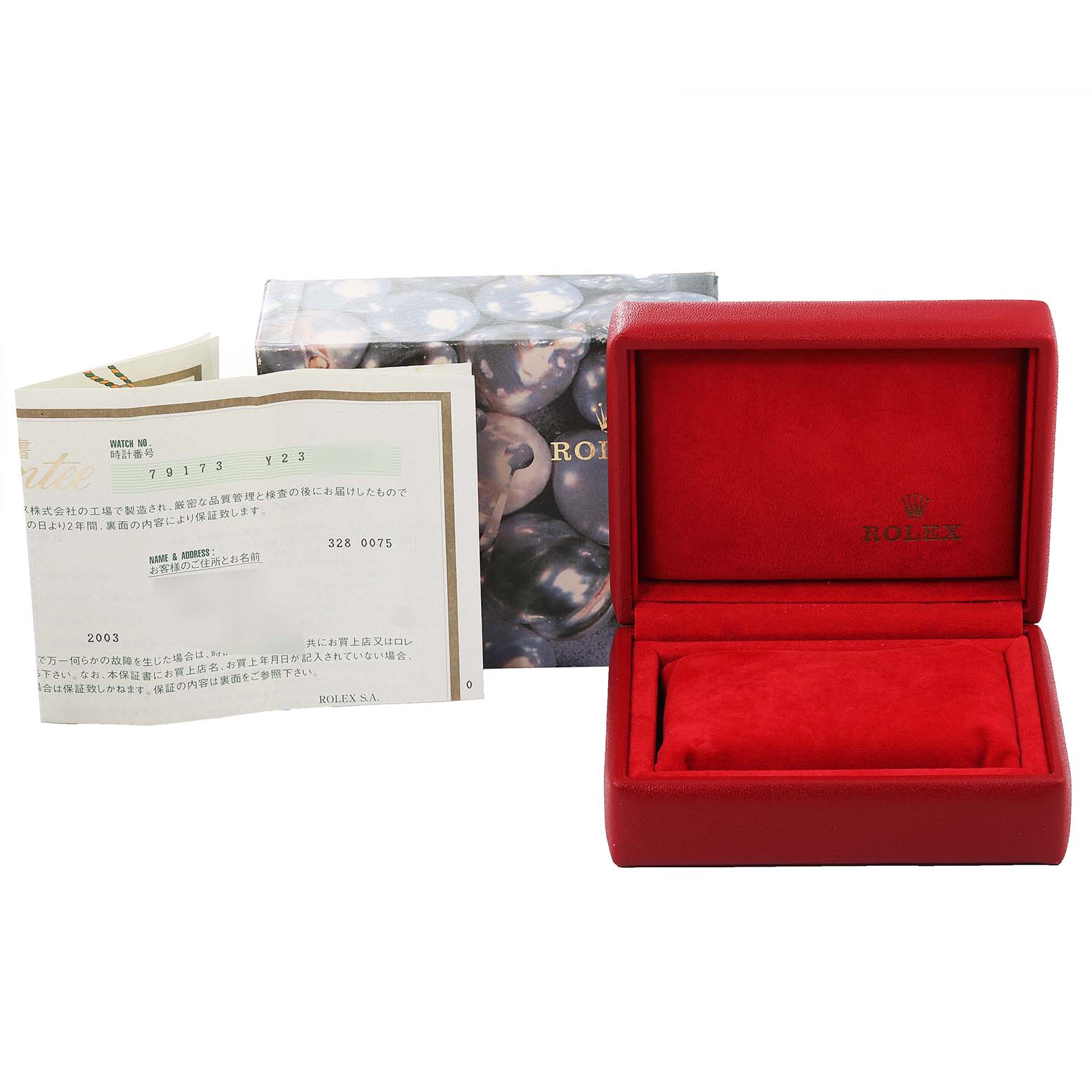 This image shows an open red Rolex watch box alongside paperwork and an outer box, all accessories for the Datejust model by Rolex.