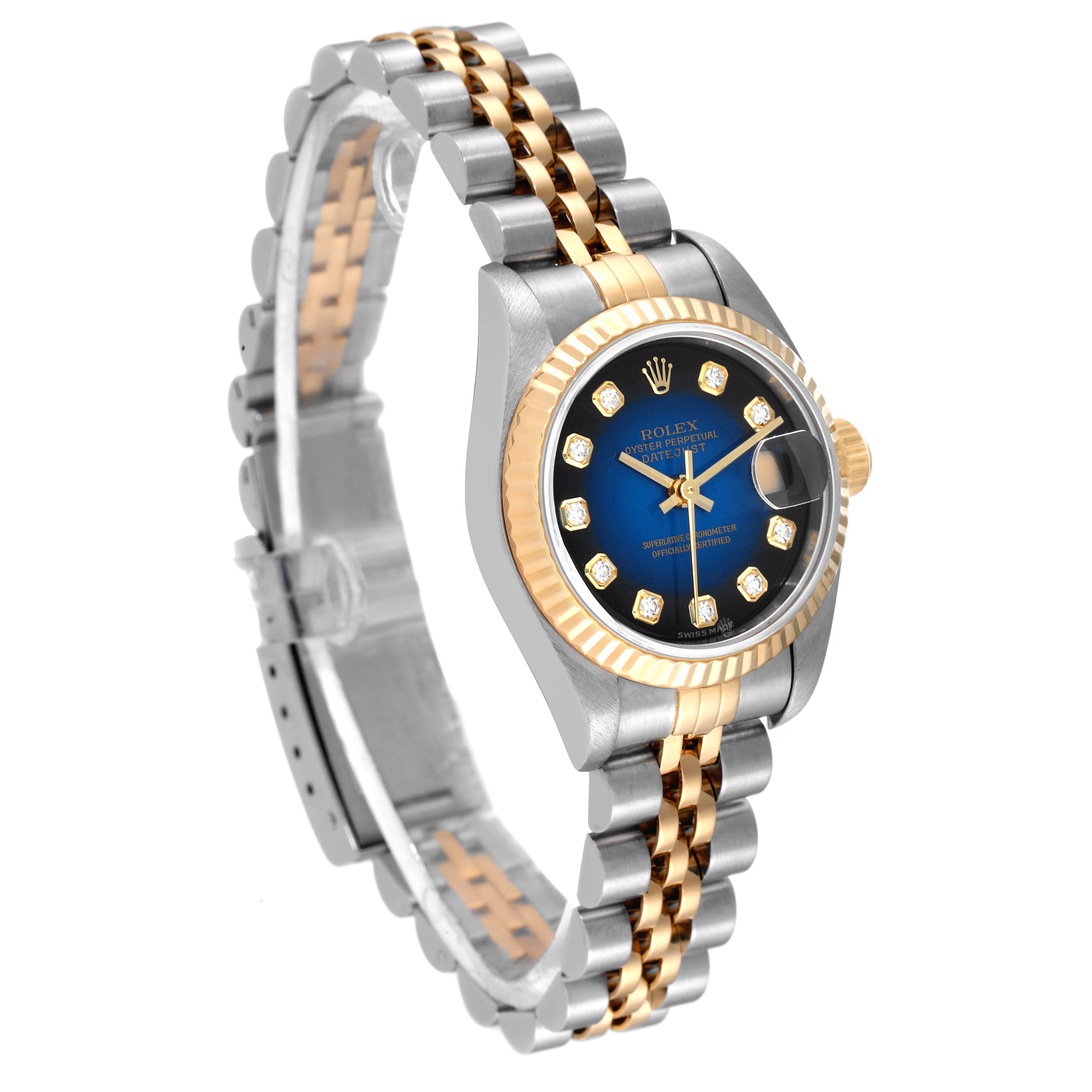 The Rolex Datejust 79173 Women
s Steel and Gold (two tone) Blue Dial 79173 Women
s Steel and Gold (two tone) Blue Dial watch is shown at a three-quarter angle, highlighting its two-tone bracelet, blue dial, and gold bezel.