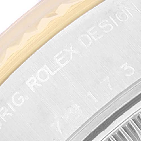 This close-up shows the engraved edge on a Rolex Datejust 79173 Women
s Steel and Gold (two tone) Blue Dial 79173 Women
s Steel and Gold (two tone) Blue Dial watch model.