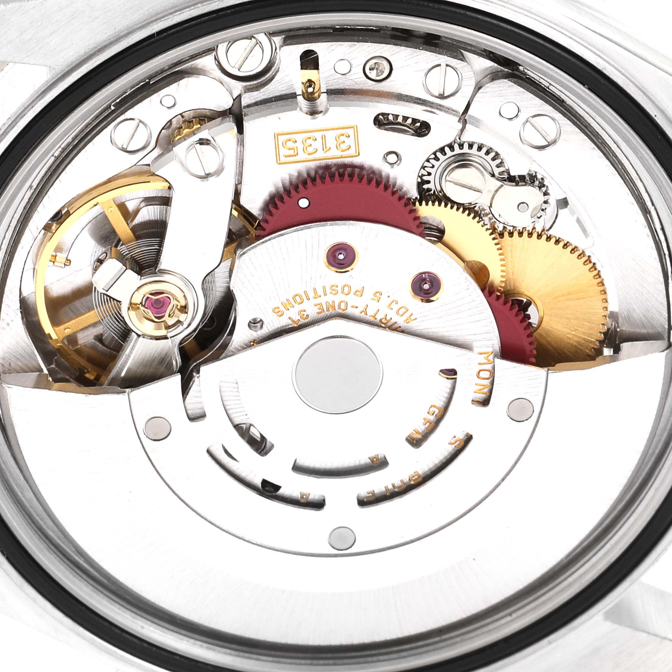 The image shows the intricate internal mechanism of a Rolex Datejust 16233 Men's Steel and Gold (two tone) White Dial 16233 Men's Steel and Gold (two tone) White Dial watch, viewed from the rear.