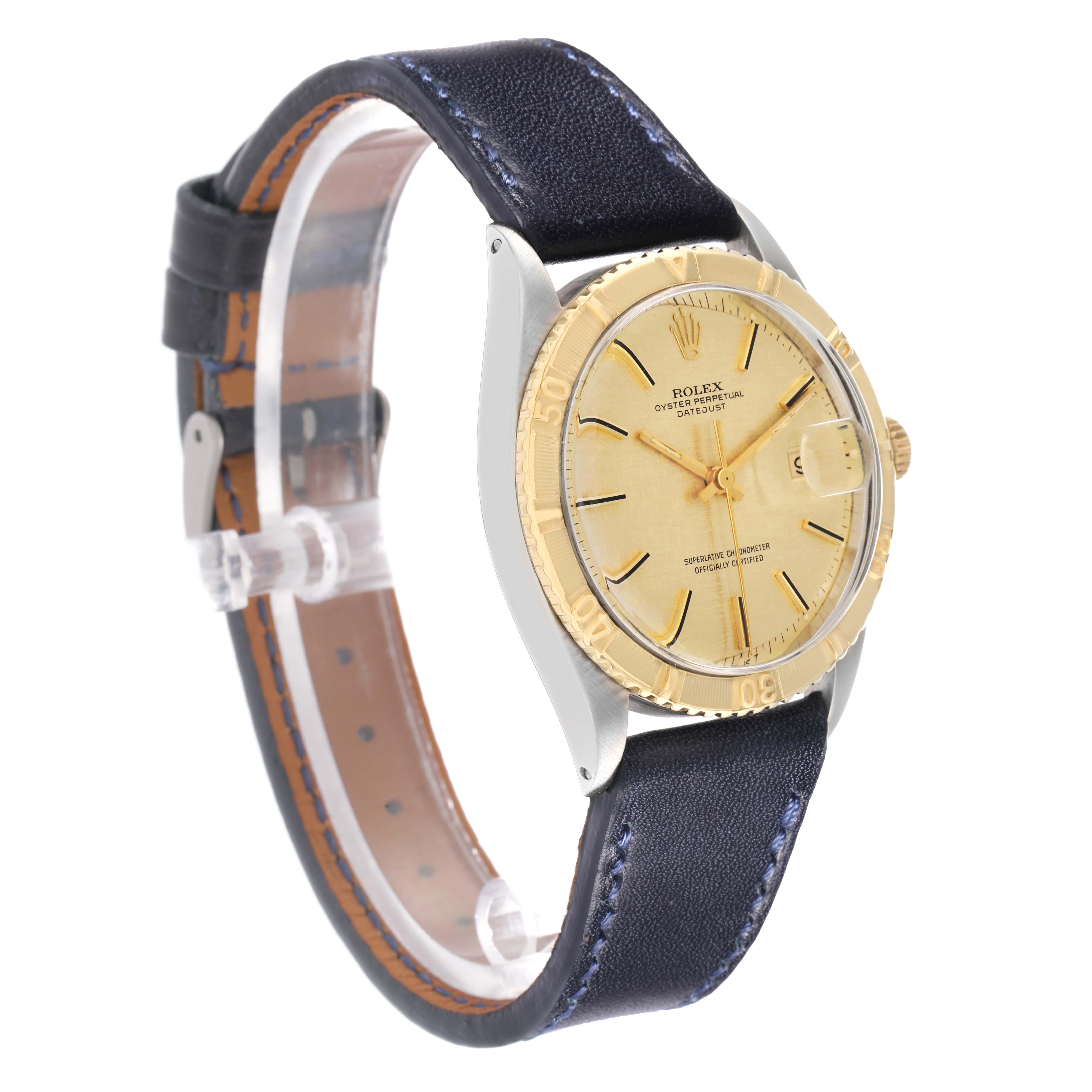 The Rolex Turn-o-Graph 1625 Men
s Steel and Gold (two tone) Champagne Dial watch is shown at a three-quarter angle, highlighting the face, bezel, and leather strap.
