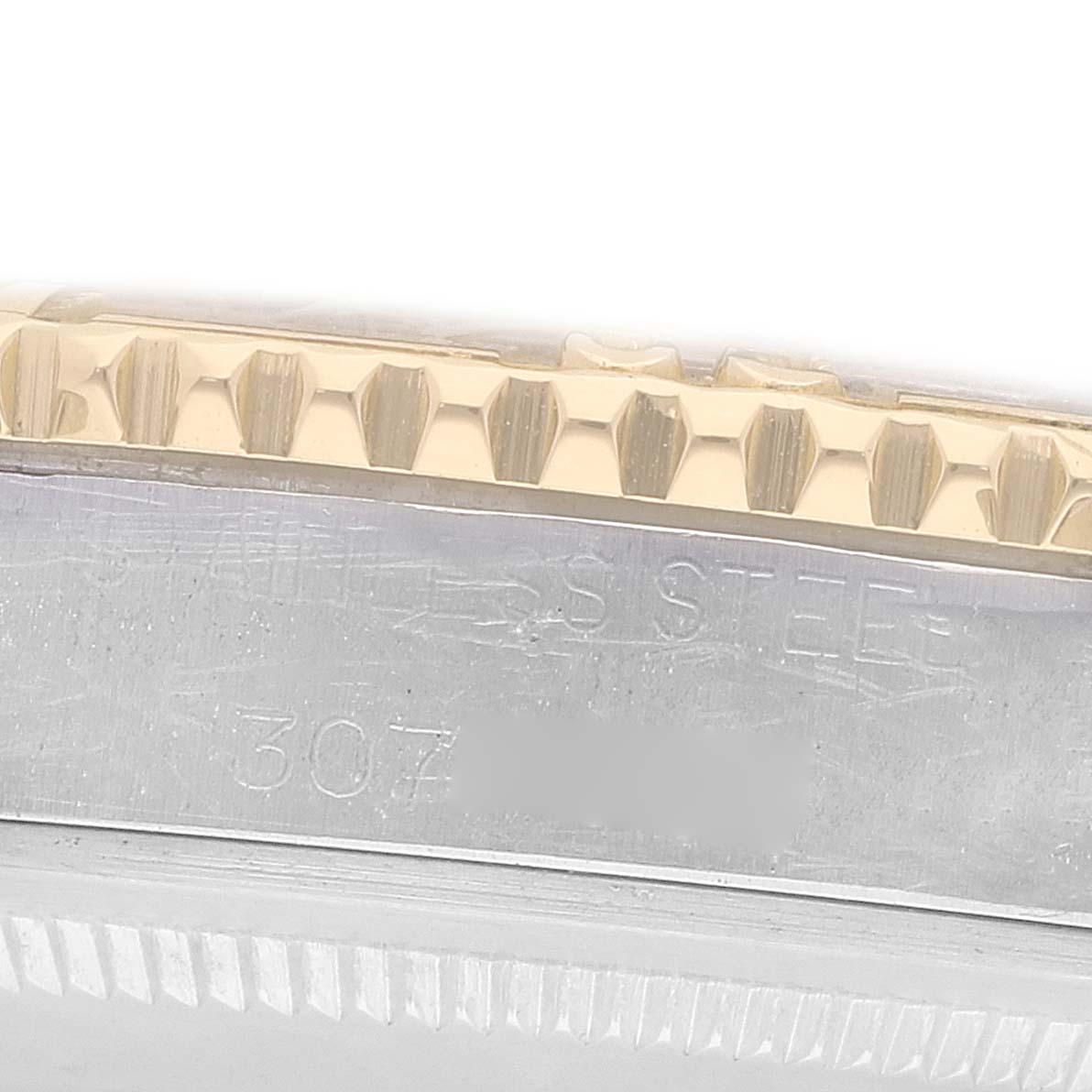 The image shows a close-up of the bezel and case edge of a Rolex Turn-o-Graph 1625 Men
s Steel and Gold (two tone) Champagne Dial watch.
