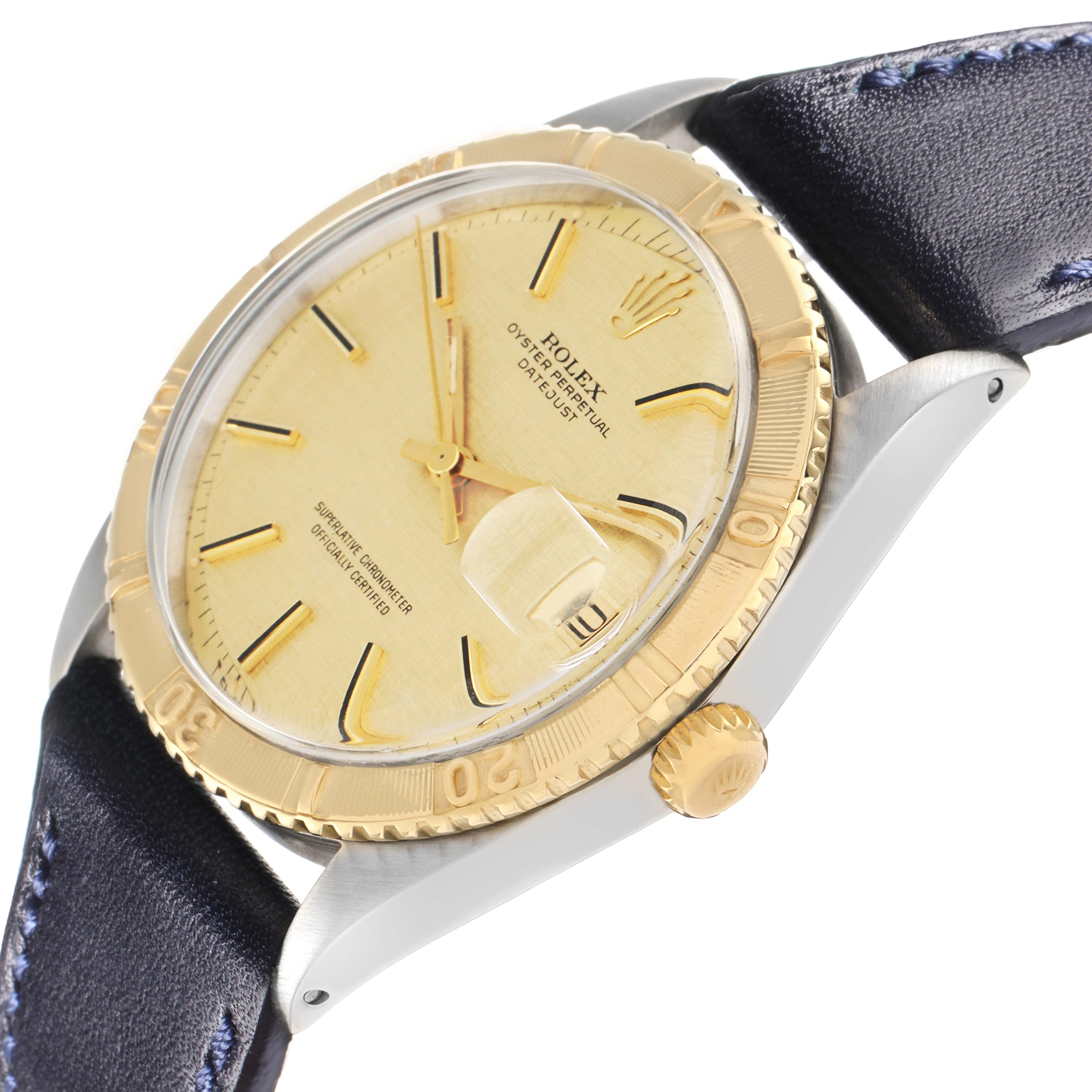 The Rolex Turn-o-Graph 1625 Men
s Steel and Gold (two tone) Champagne Dial watch is shown at a side angle, highlighting the bezel, crown, and part of the leather strap.