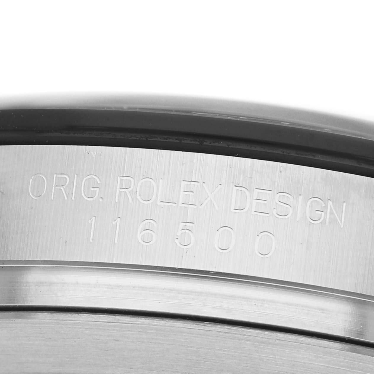 The image shows a close-up of a Rolex Daytona 116500 Men's Stainless Steel White Dial's engraved case edge, highlighting its model number "116500."