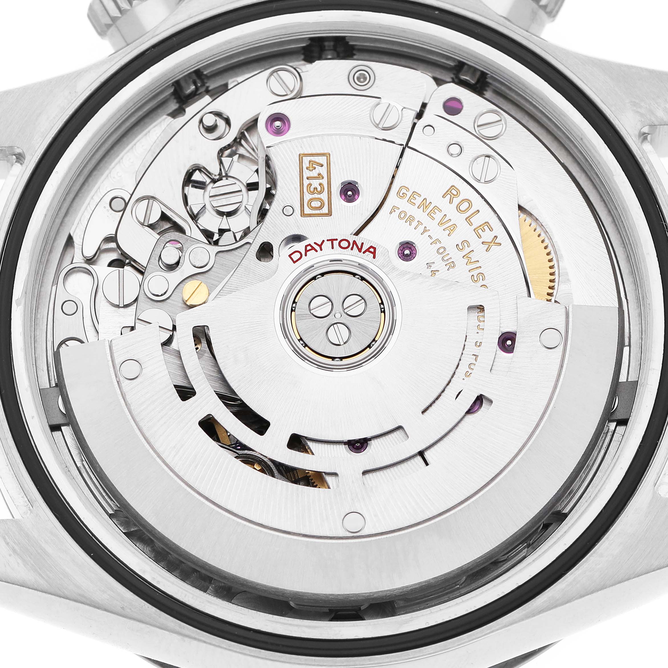 The image shows the movement of a Rolex Daytona 116500 Men's Stainless Steel White Dial watch from a back view, highlighting its intricate components.