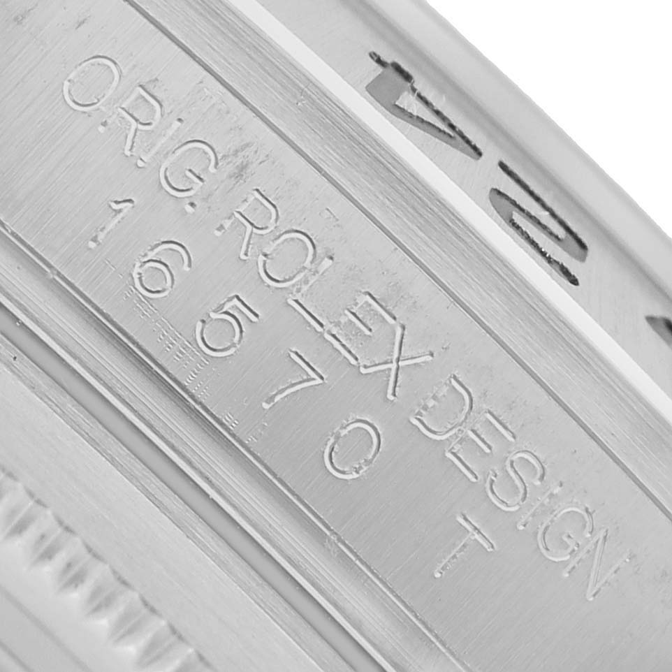 The image shows a close-up of the engraved side of a Rolex Explorer 16570 Men's Stainless Steel White Dial model case.