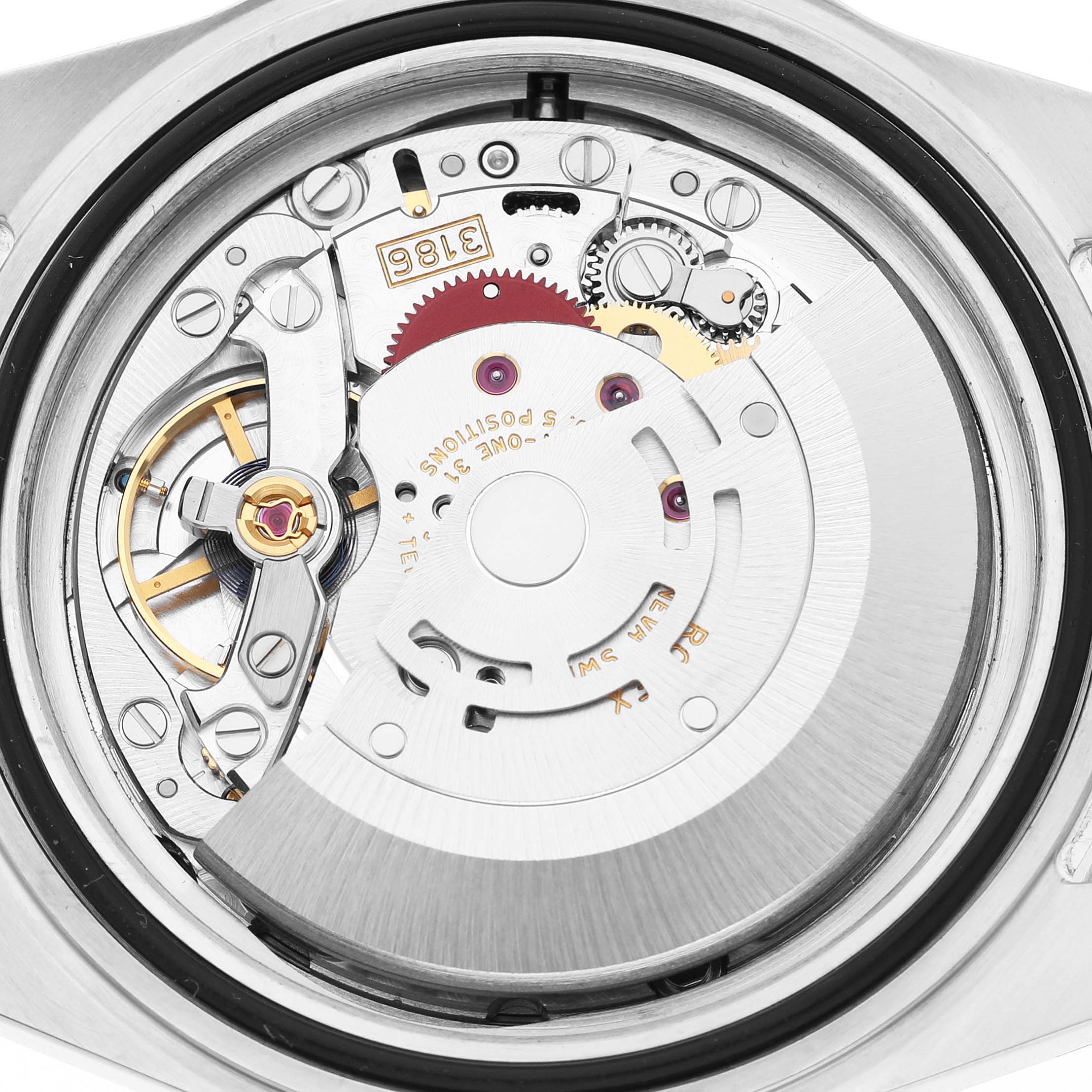 The image shows the movement of a Rolex Explorer 16570 Men's Stainless Steel White Dial model, highlighting gears and mechanical components from a rear perspective.