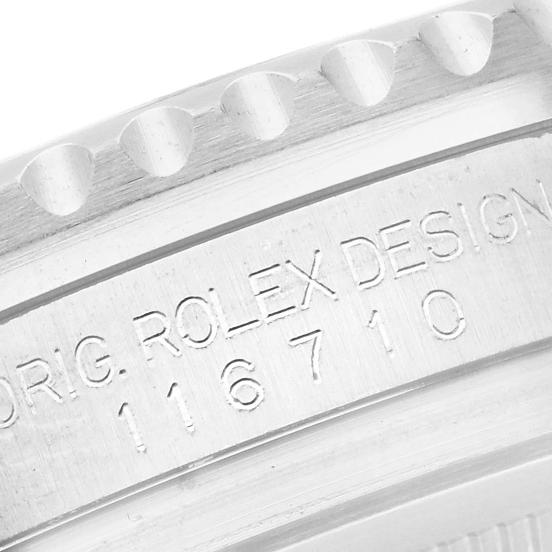 The image shows a close-up of the Rolex GMT-Master 116710 Men
s Stainless Steel Black Dial
s case side, highlighting the engraved model number.