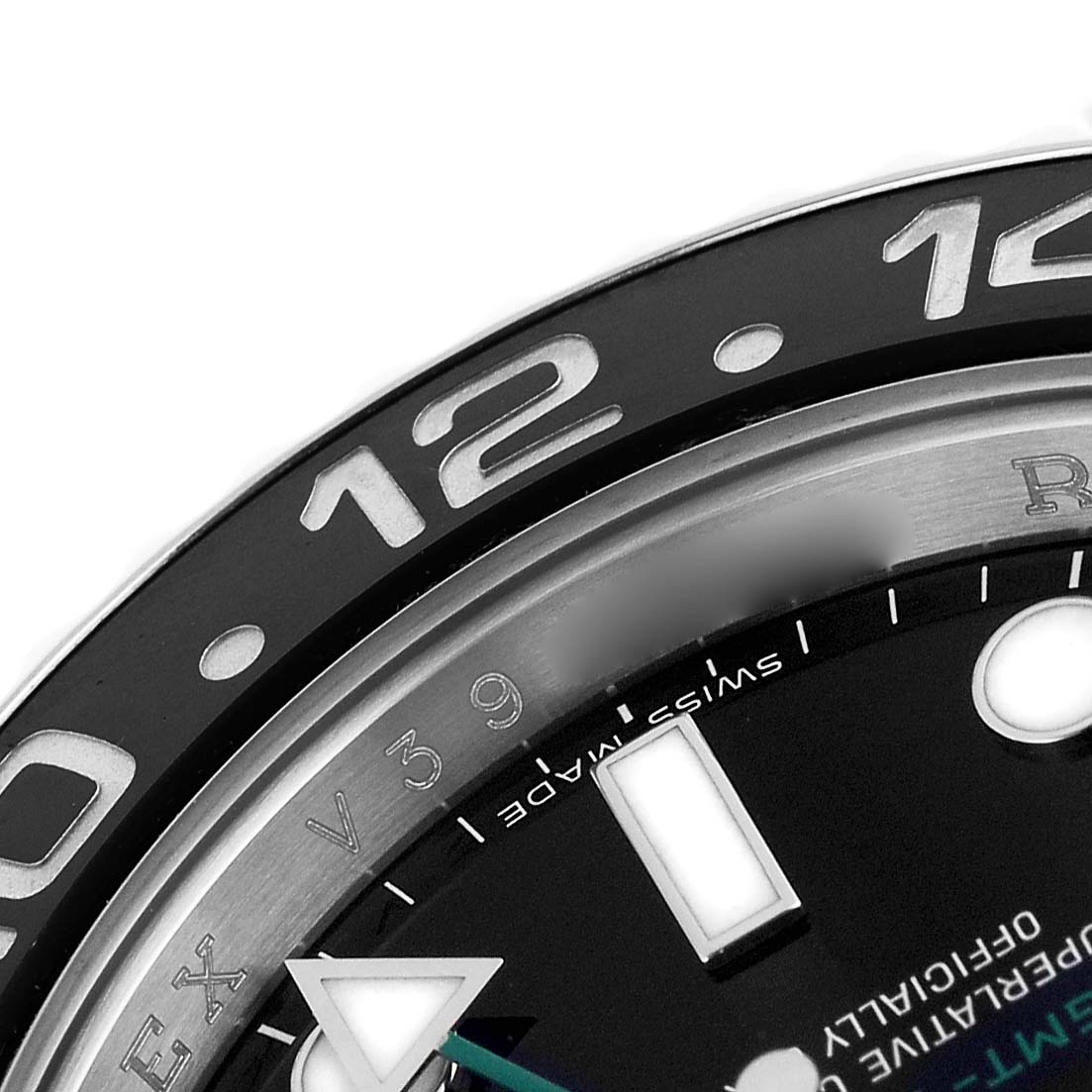 The image shows a close-up of the Rolex GMT-Master 116710 Men's Stainless Steel Black Dial's bezel and part of the dial, featuring hour markers and detailing.
