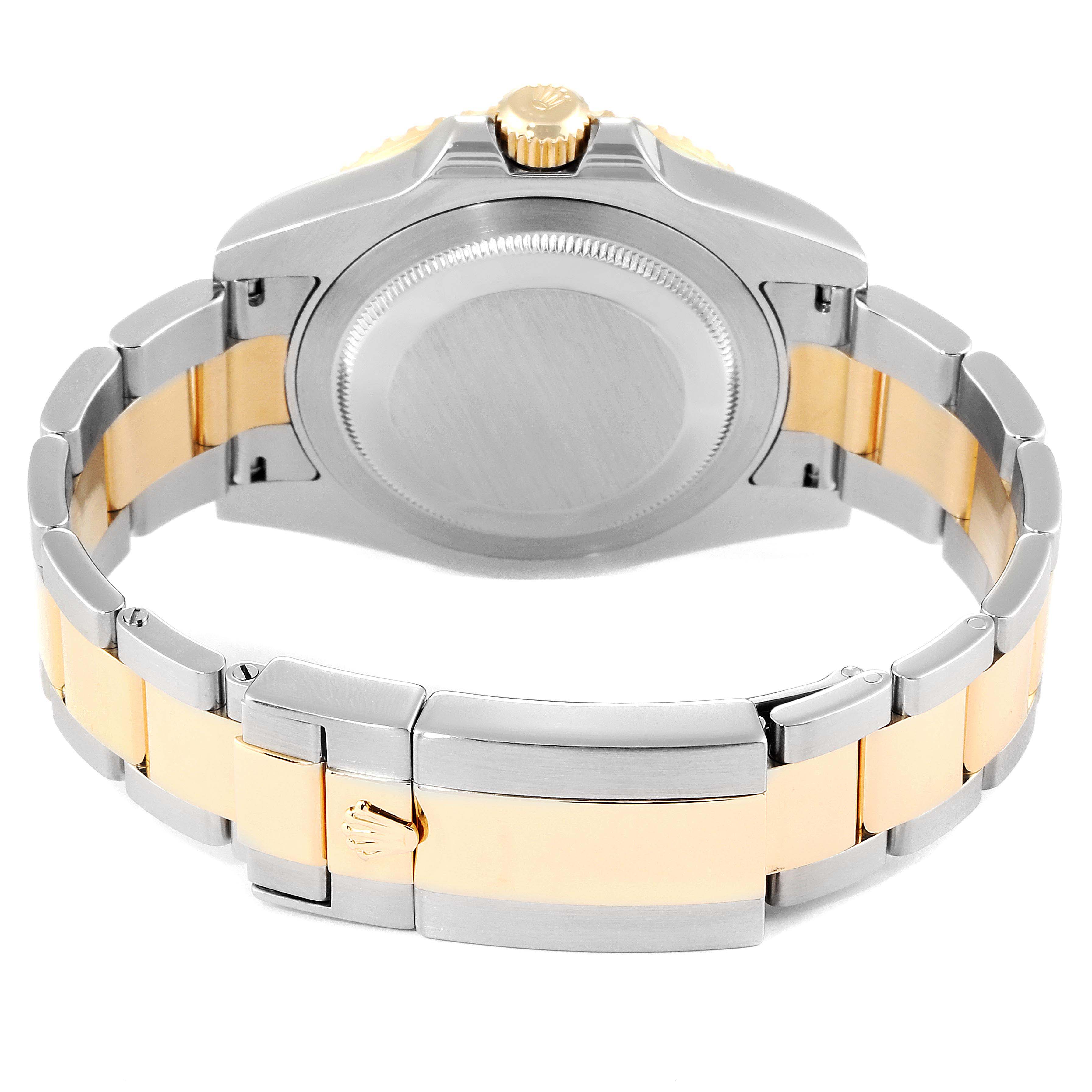 The image shows the back of a Rolex GMT-Master 116713 Men's Steel and Gold (two tone) Black Dial 116713 Men's Steel and Gold (two tone) Black Dial watch with its bracelet and clasp in view.