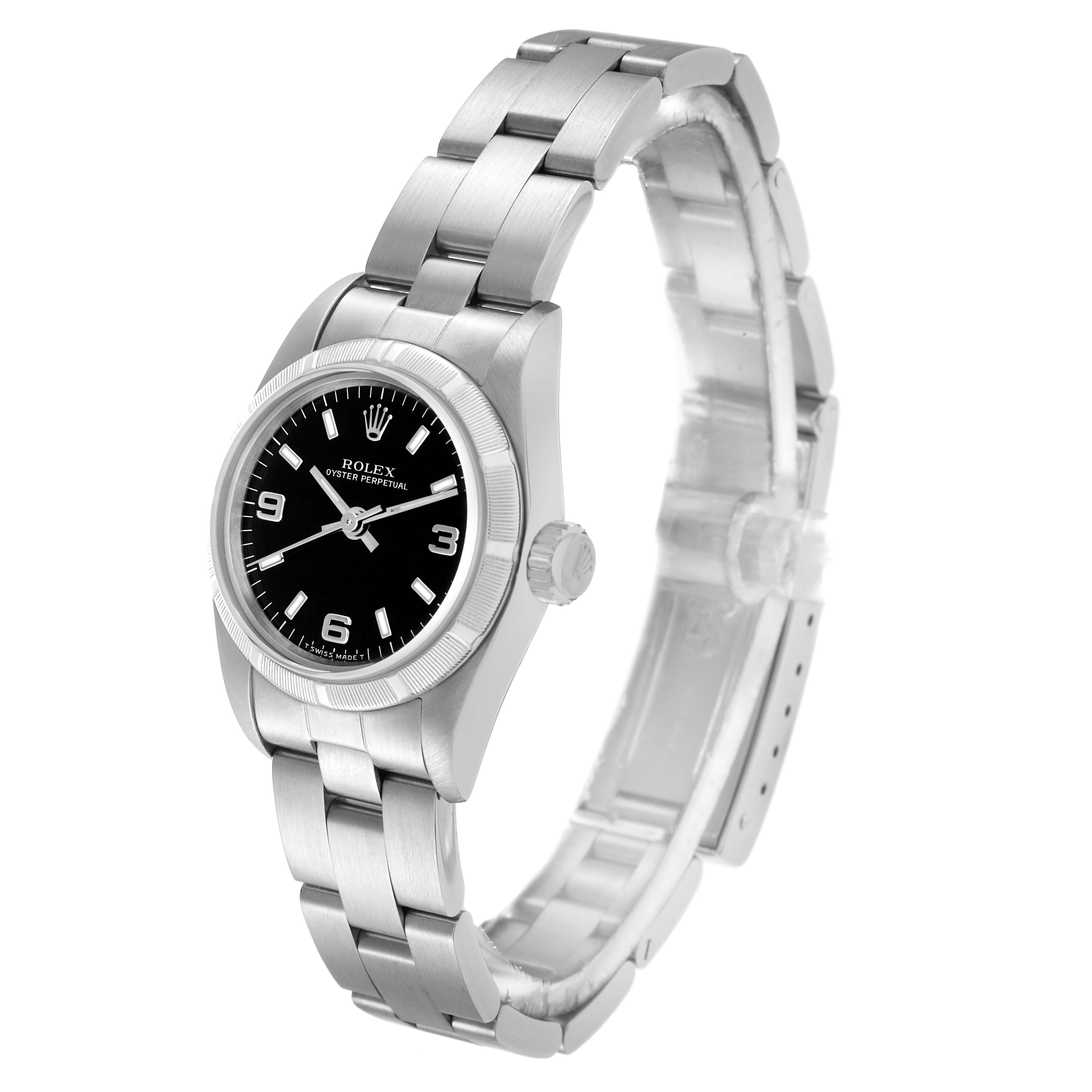 The Rolex Oyster Perpetual 67230 Women
s Stainless Steel Black Dial watch is shown at a slight angle, displaying the black dial, bezel, bracelet, and crown.