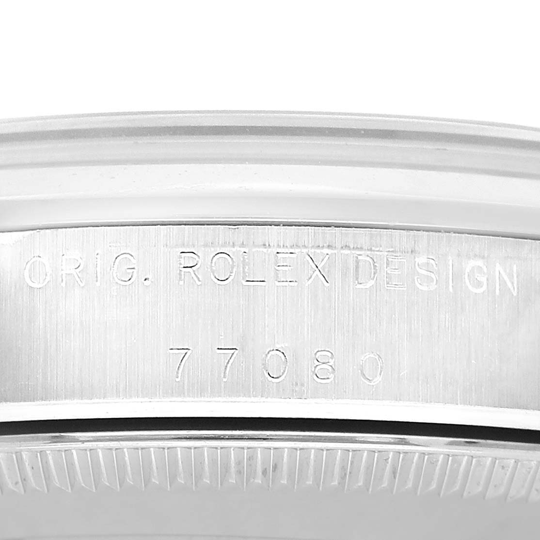The image shows the side view of the Rolex Mid-Size 77080 Women's Stainless Steel Black Dial model, focusing on the engraved serial number and "Orig. Rolex Design."