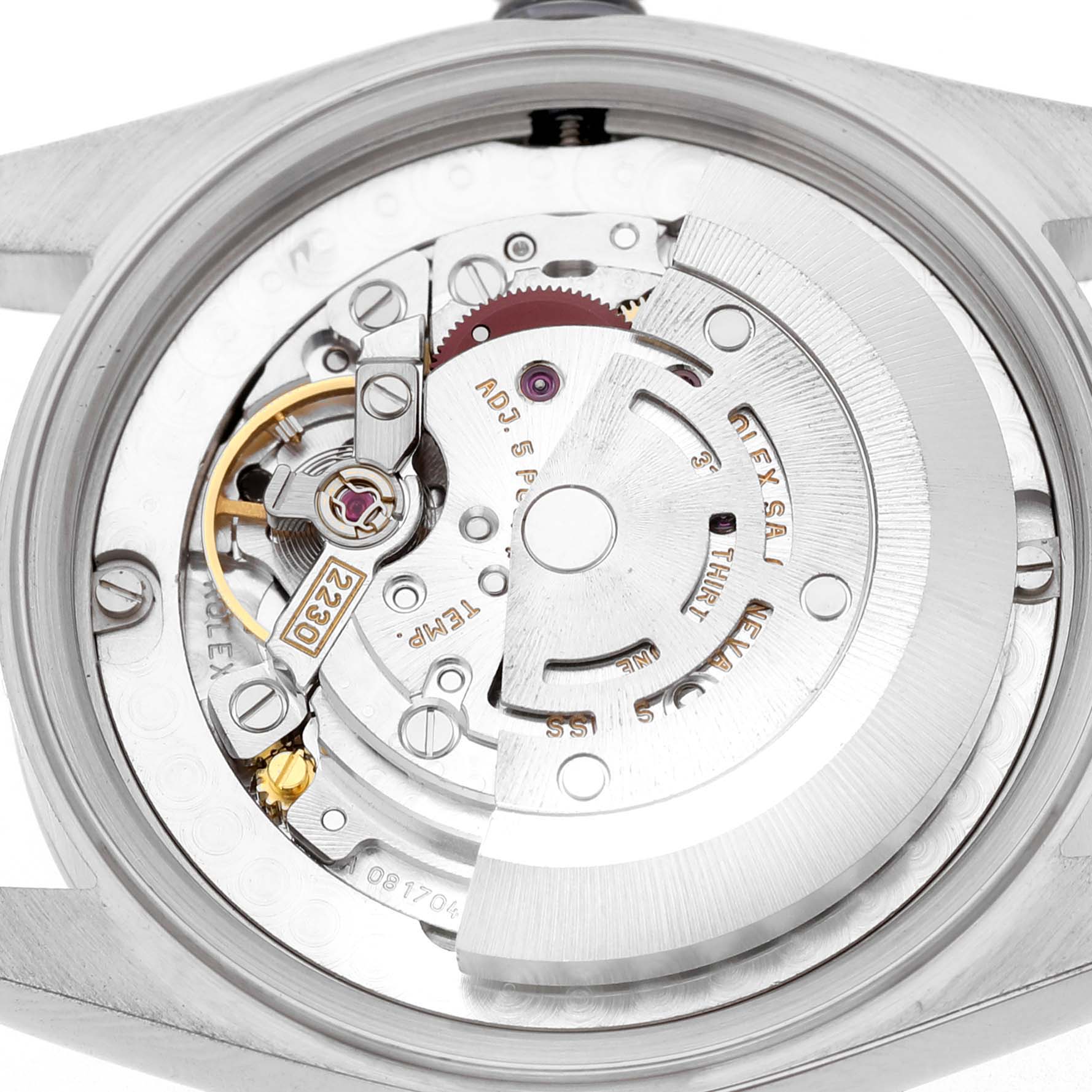 The image shows the open case back of a Mid-Size Rolex watch, revealing the intricate mechanical movement inside.