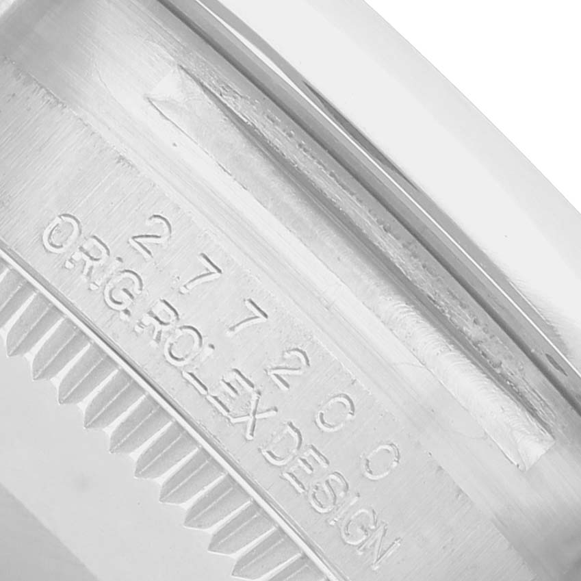 The image shows the side of a Rolex Mid-Size 277200 Women's Stainless Steel Pink Dial watch with engraved model details.