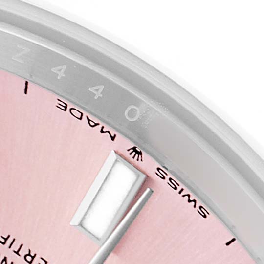 The image shows a close-up of the dial and bezel of a Rolex Mid-Size 277200 Women's Stainless Steel Pink Dial watch, highlighting the "SWISS MADE" text.