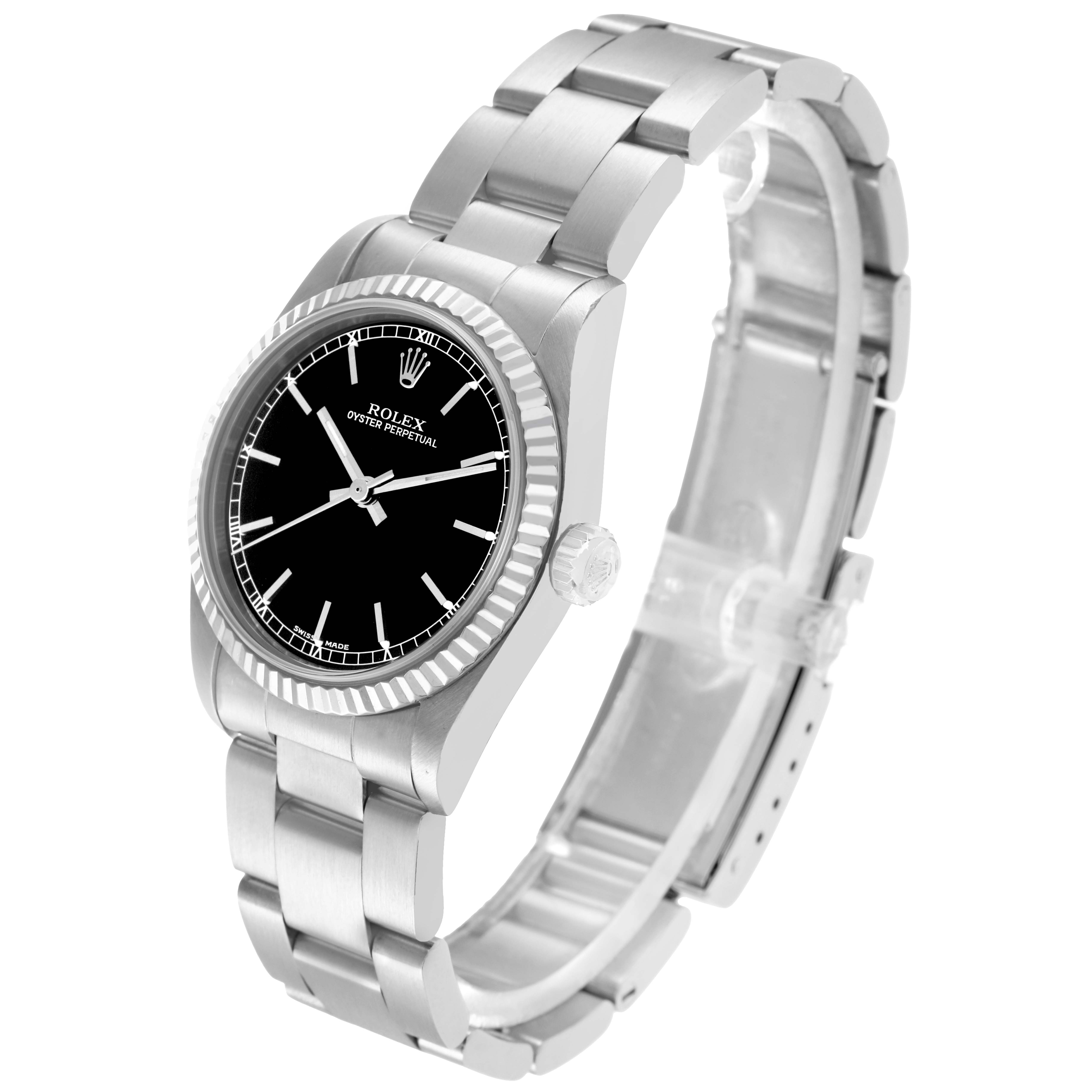 The Rolex Oyster Perpetual 77014 Women
s Stainless Steel Black Dial watch is shown at a slight angle showcasing the face, bezel, crown, and bracelet.