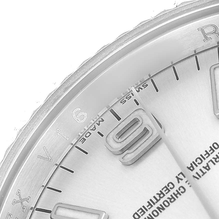 The image shows a close-up of the dial and part of the bezel of a Rolex Oyster Perpetual 116034 Men's Stainless Steel Silver Dial watch.