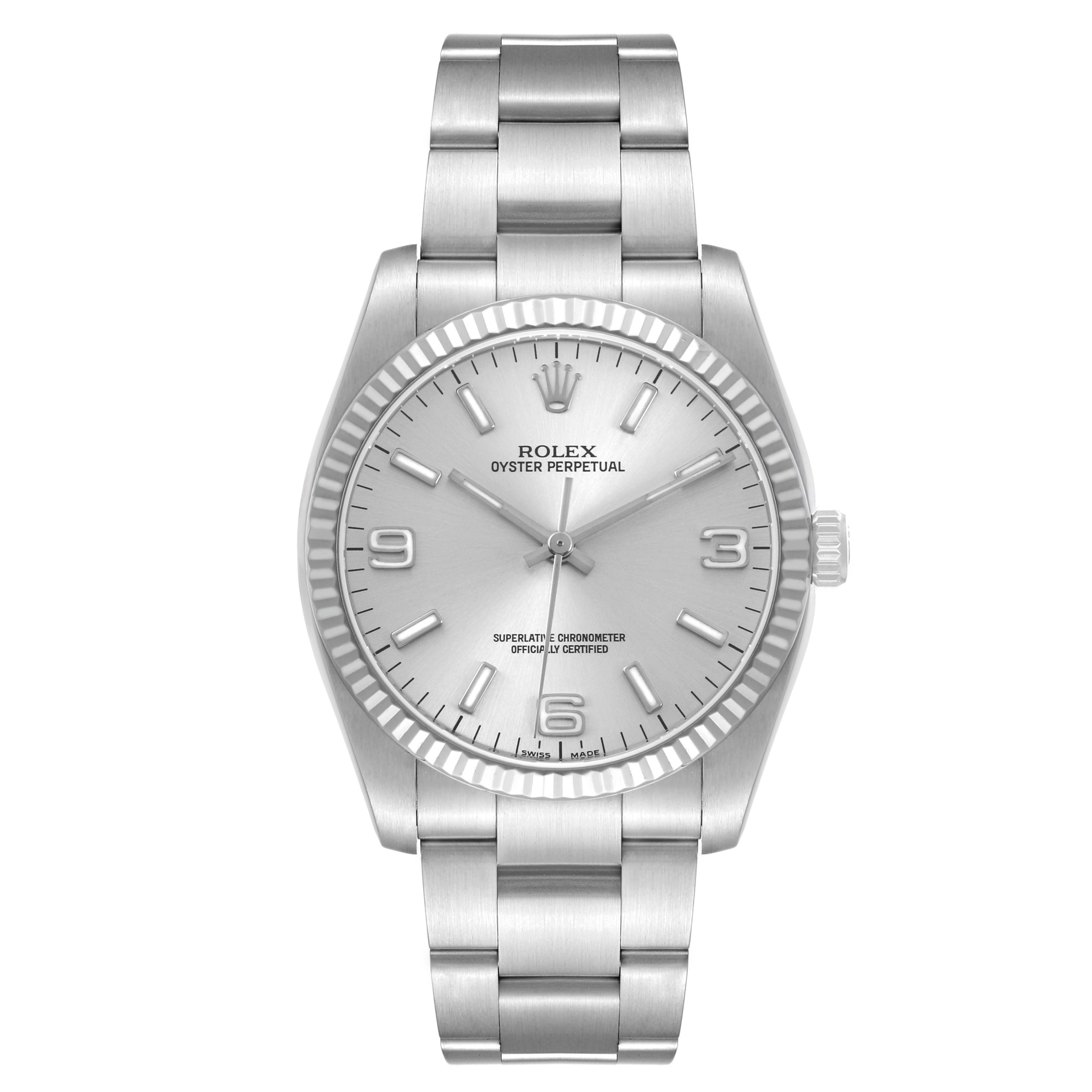 The Rolex Oyster Perpetual 116034 Men's Stainless Steel Silver Dial watch is shown from a top-down angle, displaying the dial, bezel, and full bracelet.