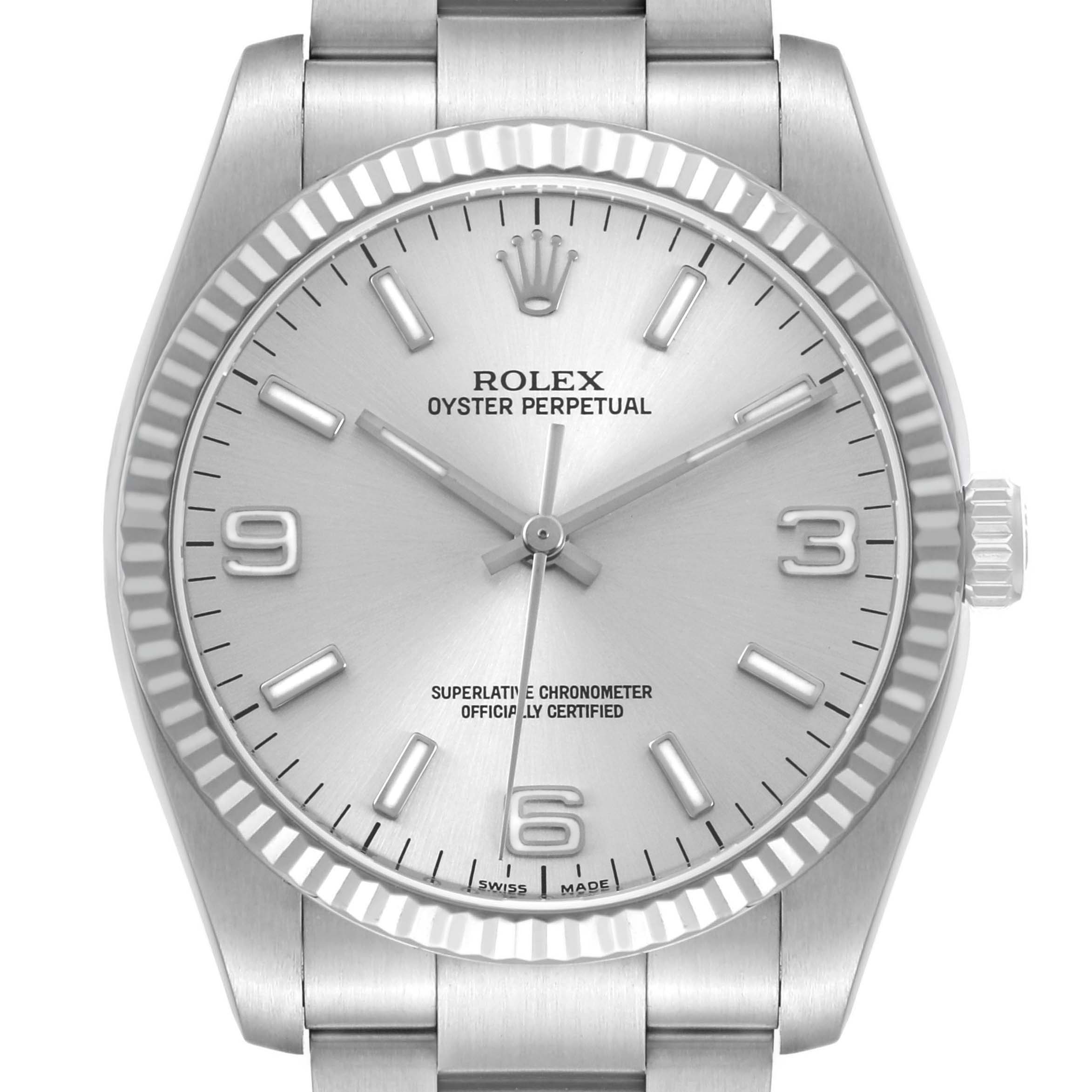 The Rolex Oyster Perpetual 116034 Men's Stainless Steel Silver Dial watch is shown from the front, highlighting the dial, hour markers, and fluted bezel.