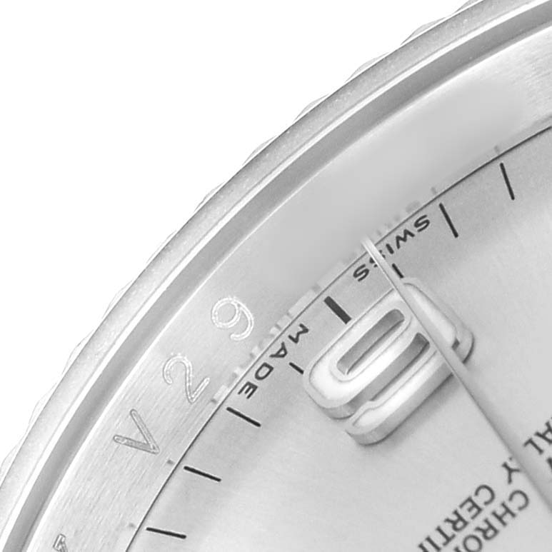 This close-up angle of the Rolex Oyster Perpetual 116034 Men's Stainless Steel Silver Dial watch shows the dial with partial view of the hour markers, hands, and "SWISS MADE" text.