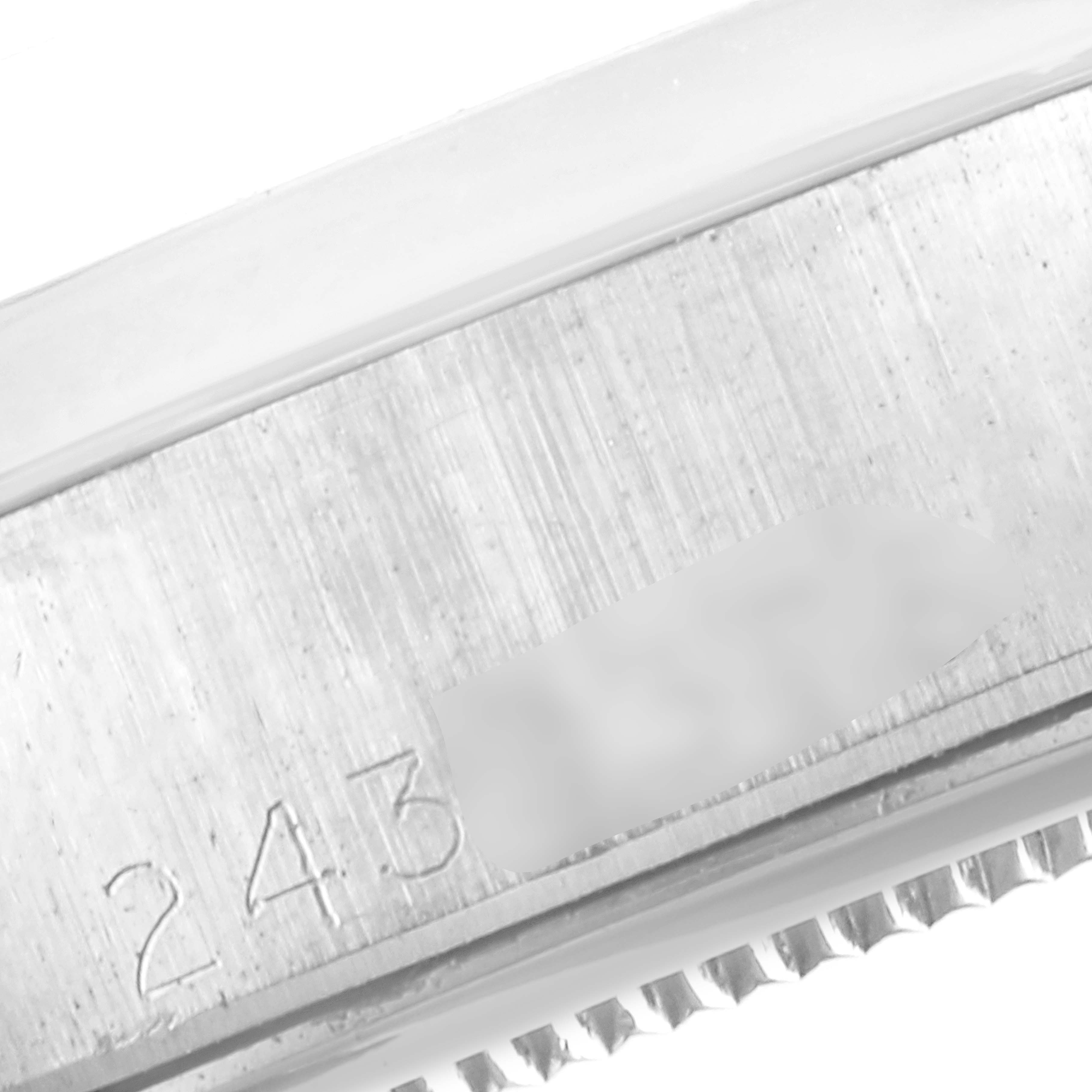 This close-up image shows the engraved details on the side of the Vintage Collection Rolex watch casing.