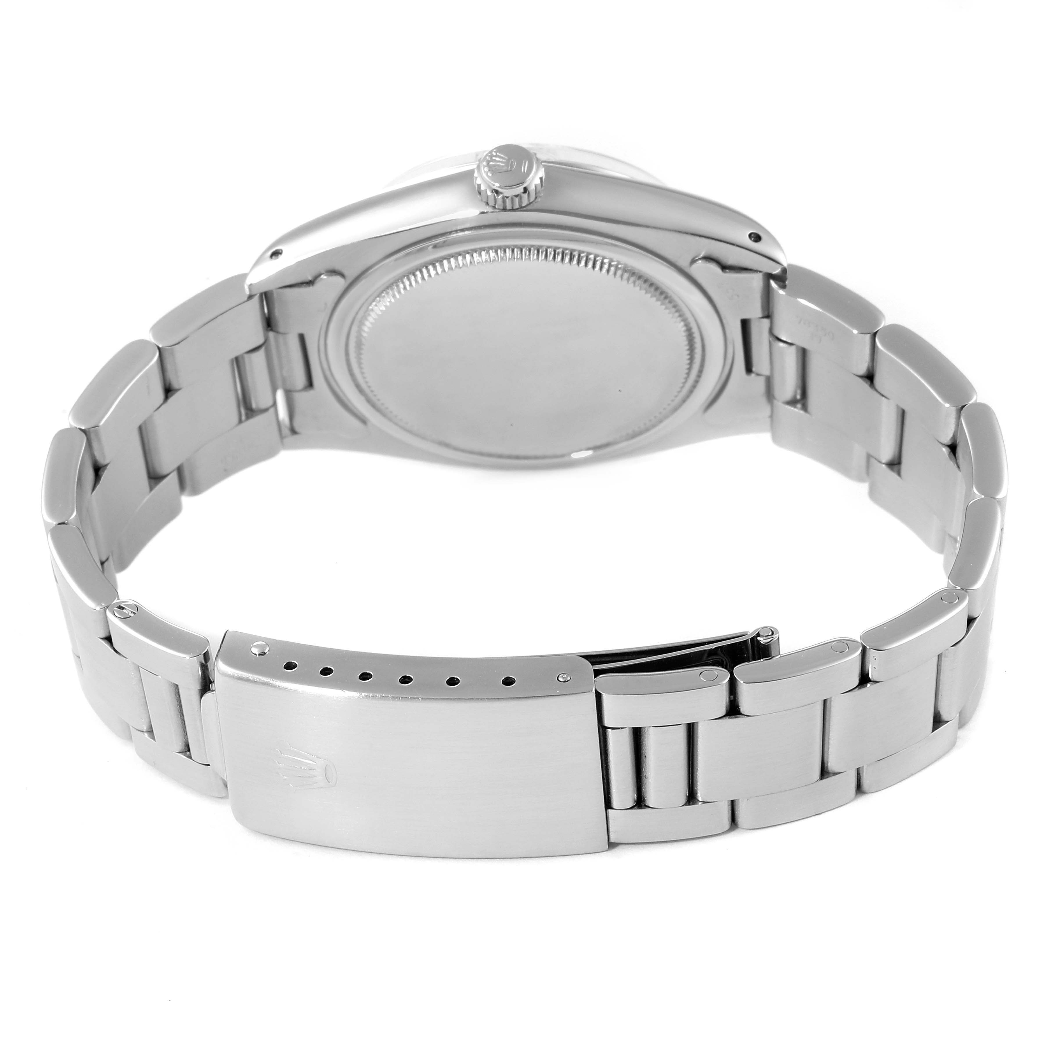 The image shows the back view of the Rolex Vintage Collection 6694 Men's Stainless Steel Silver Dial 6694 Men's Stainless Steel Silver Dial model, highlighting its closed clasp and metal bracelet.