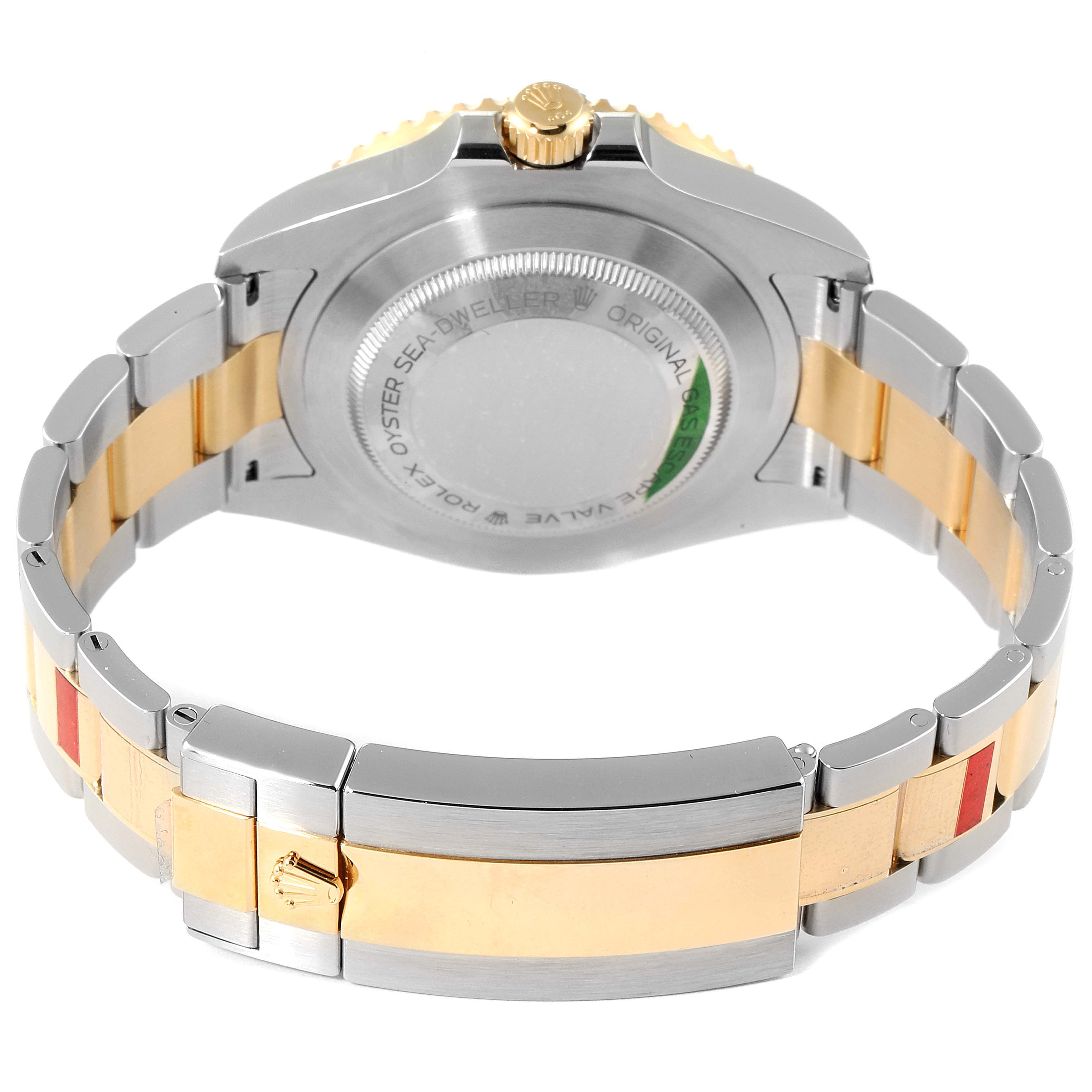 The image shows the back case and bracelet of a Rolex Sea-Dweller 126603 Men's Steel and Gold (two tone) Black Dial 126603 Men's Steel and Gold (two tone) Black Dial watch, with a focus on the two-tone metal parts and engraved details.