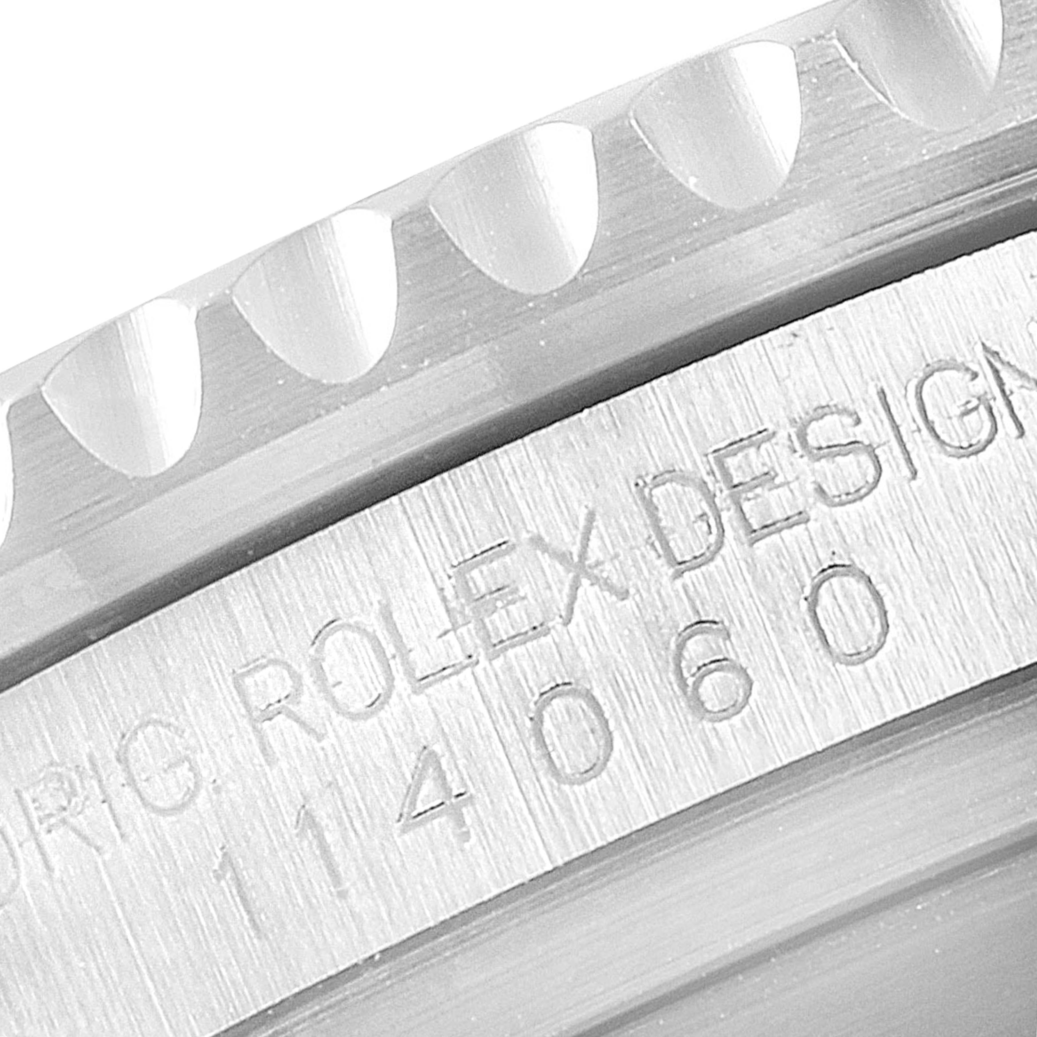 The image shows a close-up angle of the bezel and engraved model number of the Rolex Submariner 114060 Men's Stainless Steel Black Dial 114060 Men's Stainless Steel Black Dial watch.