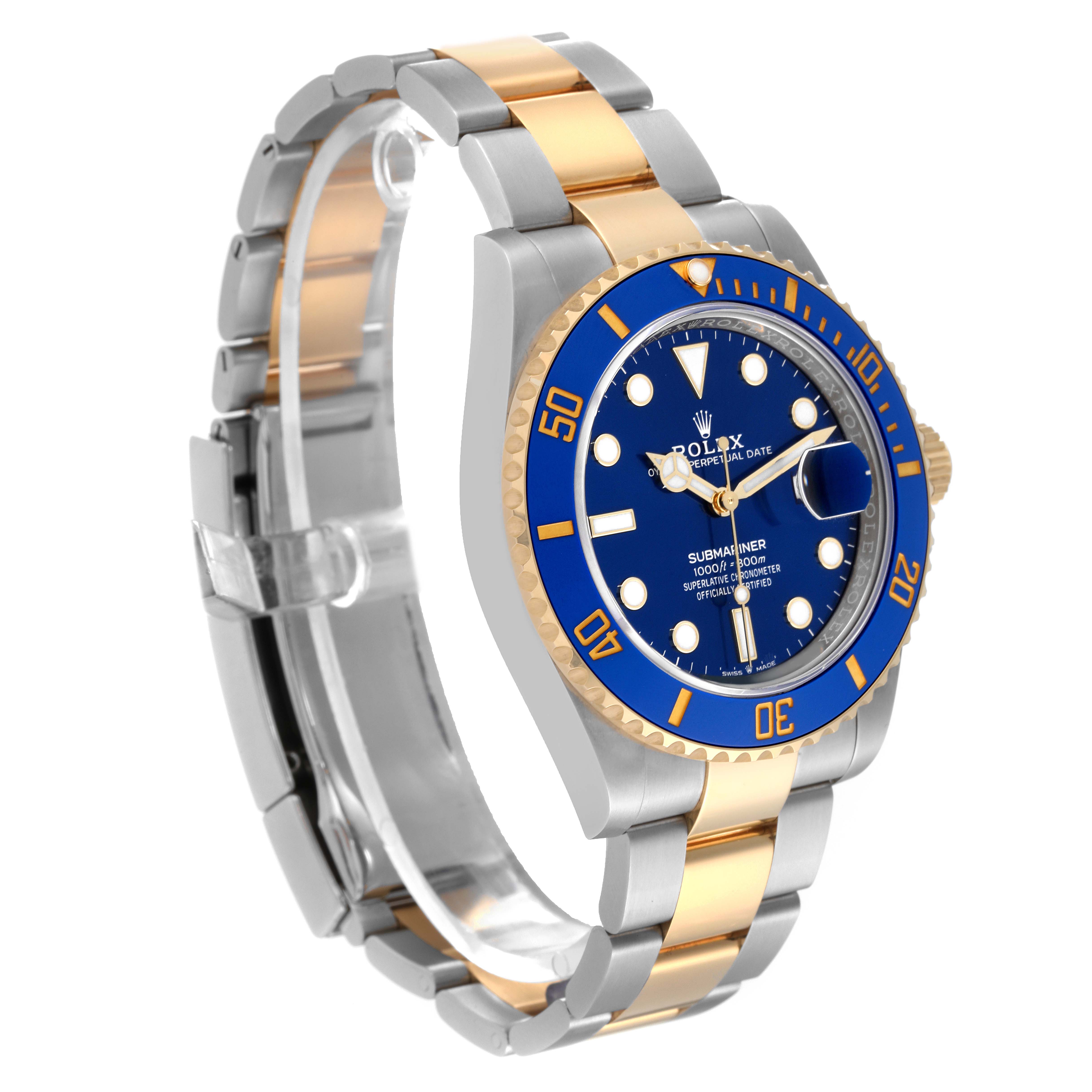 The Rolex Submariner 126613 Men's Steel and Gold (two tone) Blue Dial 126613 Men's Steel and Gold (two tone) Blue Dial watch is shown at a three-quarter angle, displaying its blue dial, bezel, and two-tone bracelet.