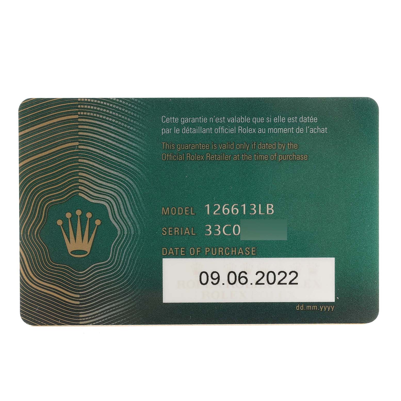 The image shows a green official Rolex warranty card for the Submariner model 126613LB, with purchase details.