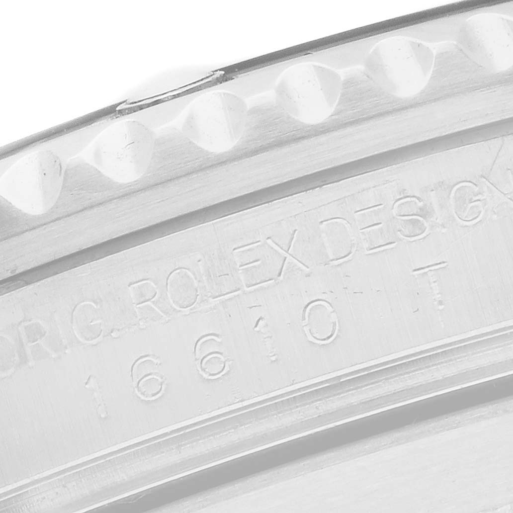The image shows a close-up of the Rolex Submariner 16610 Men
s Stainless Steel Black Dial
s engraved case side, highlighting the design and reference number.