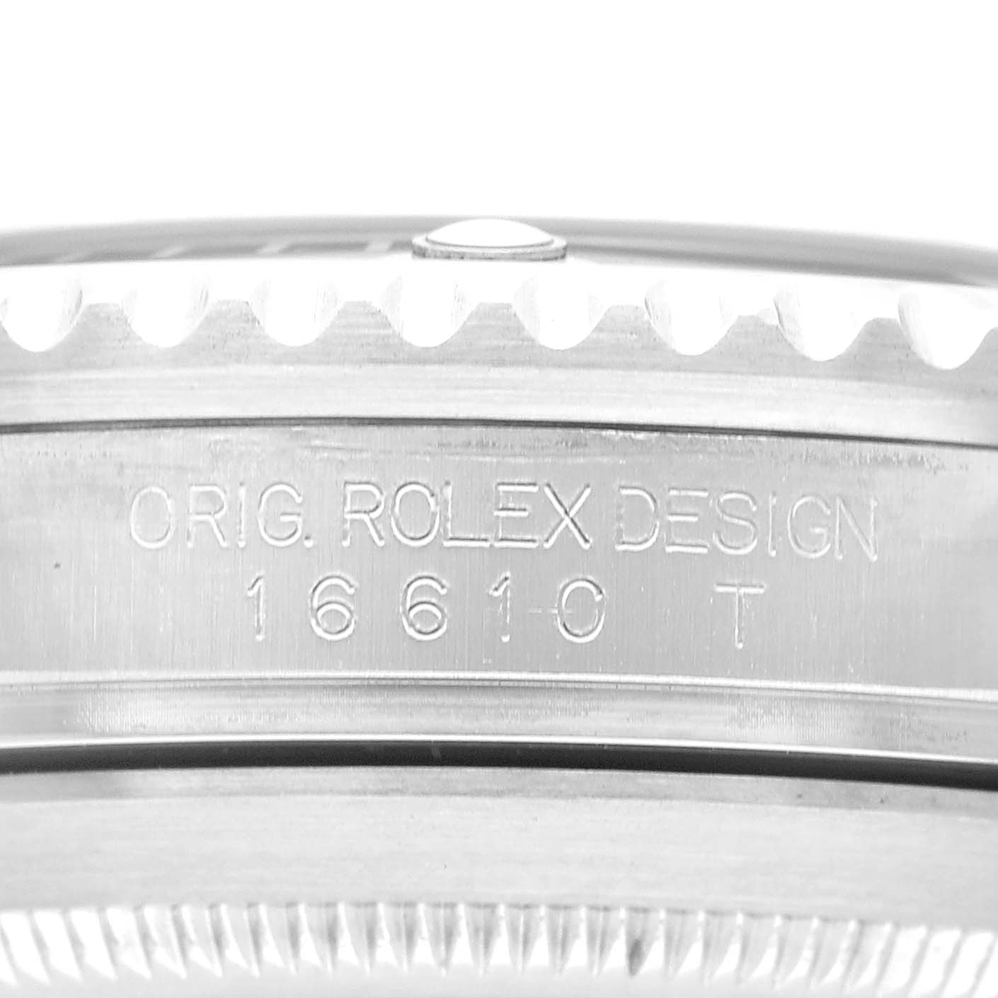 The image shows a close-up side view of a Rolex Submariner 16610 Men's Stainless Steel Black Dial, focusing on the engraved model reference number and design inscription.