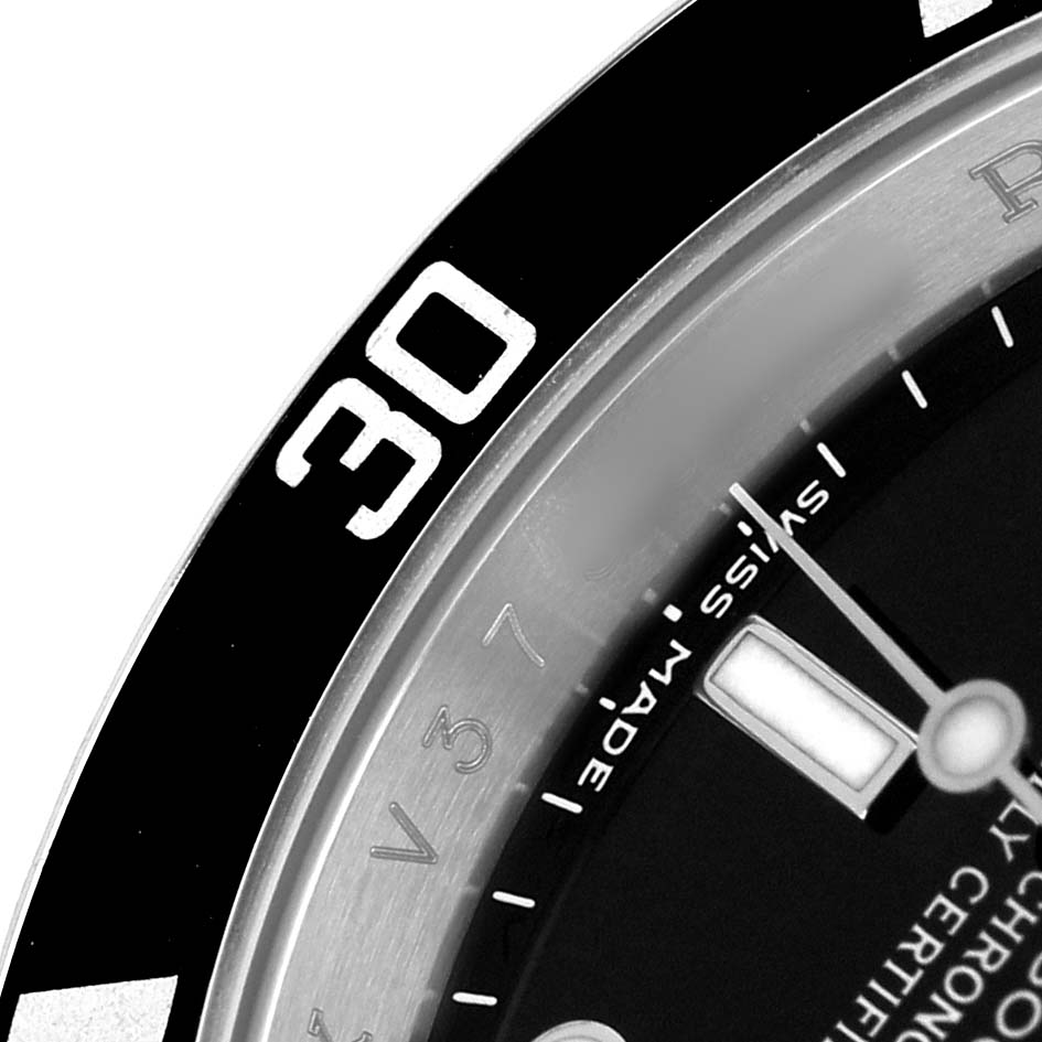 The image shows a close-up of the bezel and dial of a Rolex Submariner 16610 Men's Stainless Steel Black Dial watch, focusing on the "30" mark and minute markers.