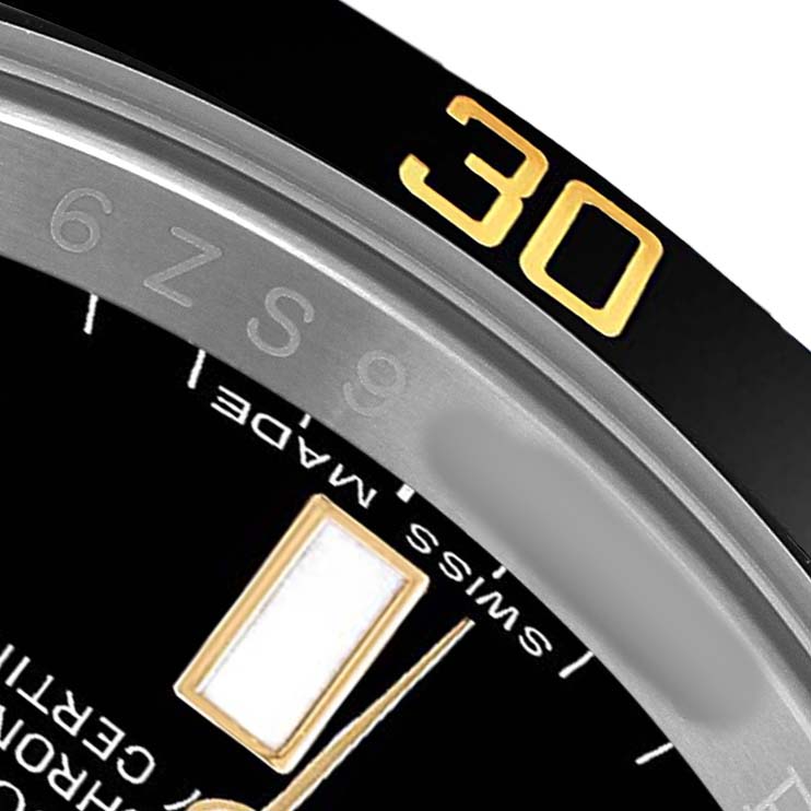 The image shows a close-up of the bezel and part of the dial of a Rolex Submariner 116613 Men's Steel and Gold (two tone) Black Dial, highlighting the numeral "30" and some inscriptions.