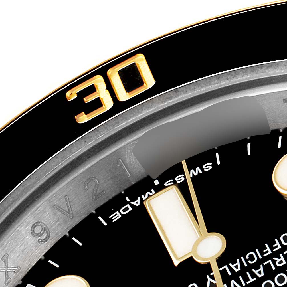 This close-up angle showcases the bezel, part of the minute markers, and hands of the Rolex Submariner 116613 Men
s Steel and Gold (two tone) Black Dial 116613 Men
s Steel and Gold (two tone) Black Dial watch.