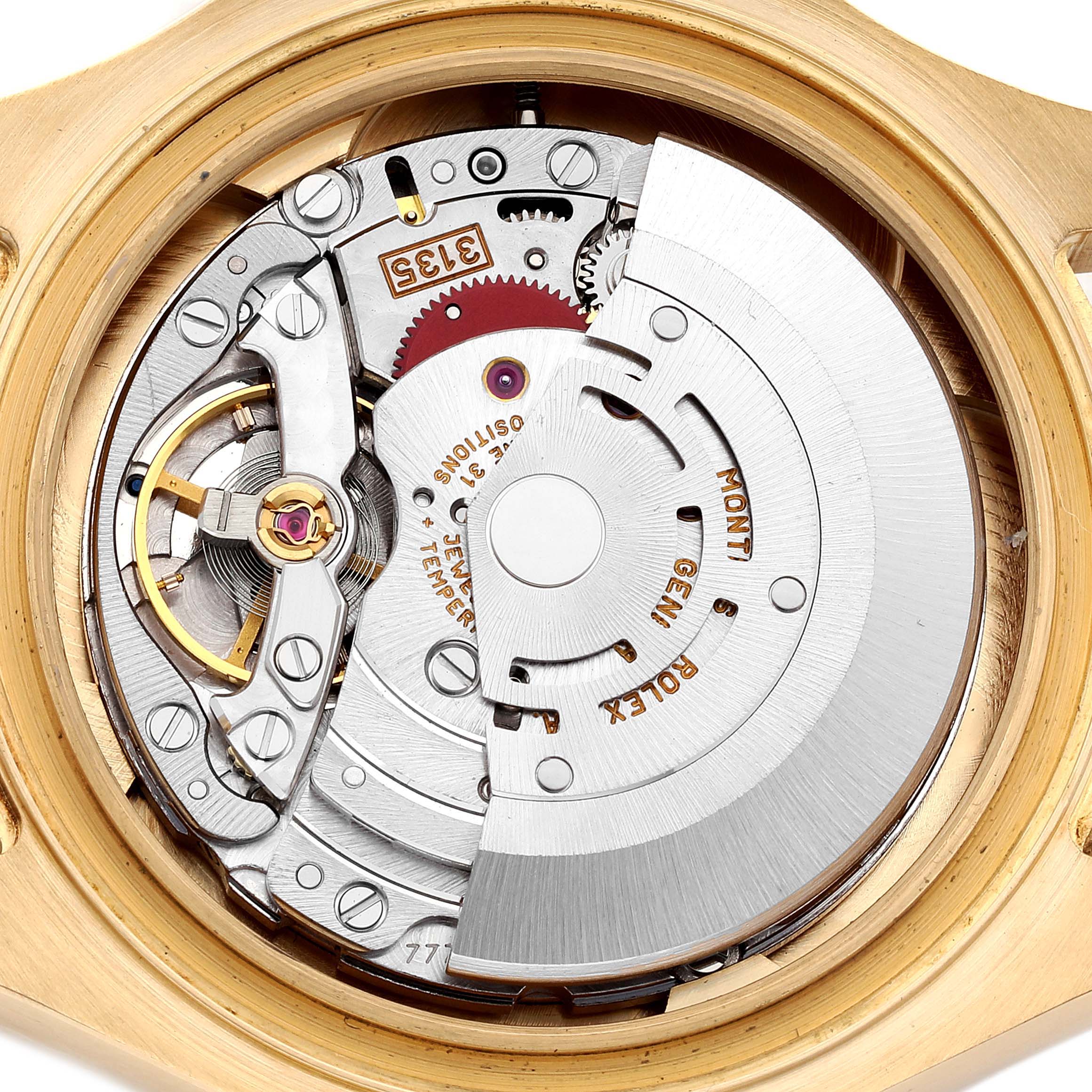 The image shows the movement of a Rolex Yacht-Master 16628 Men's Yellow Gold White Dial watch from a top-down view, highlighting its intricate internal components.