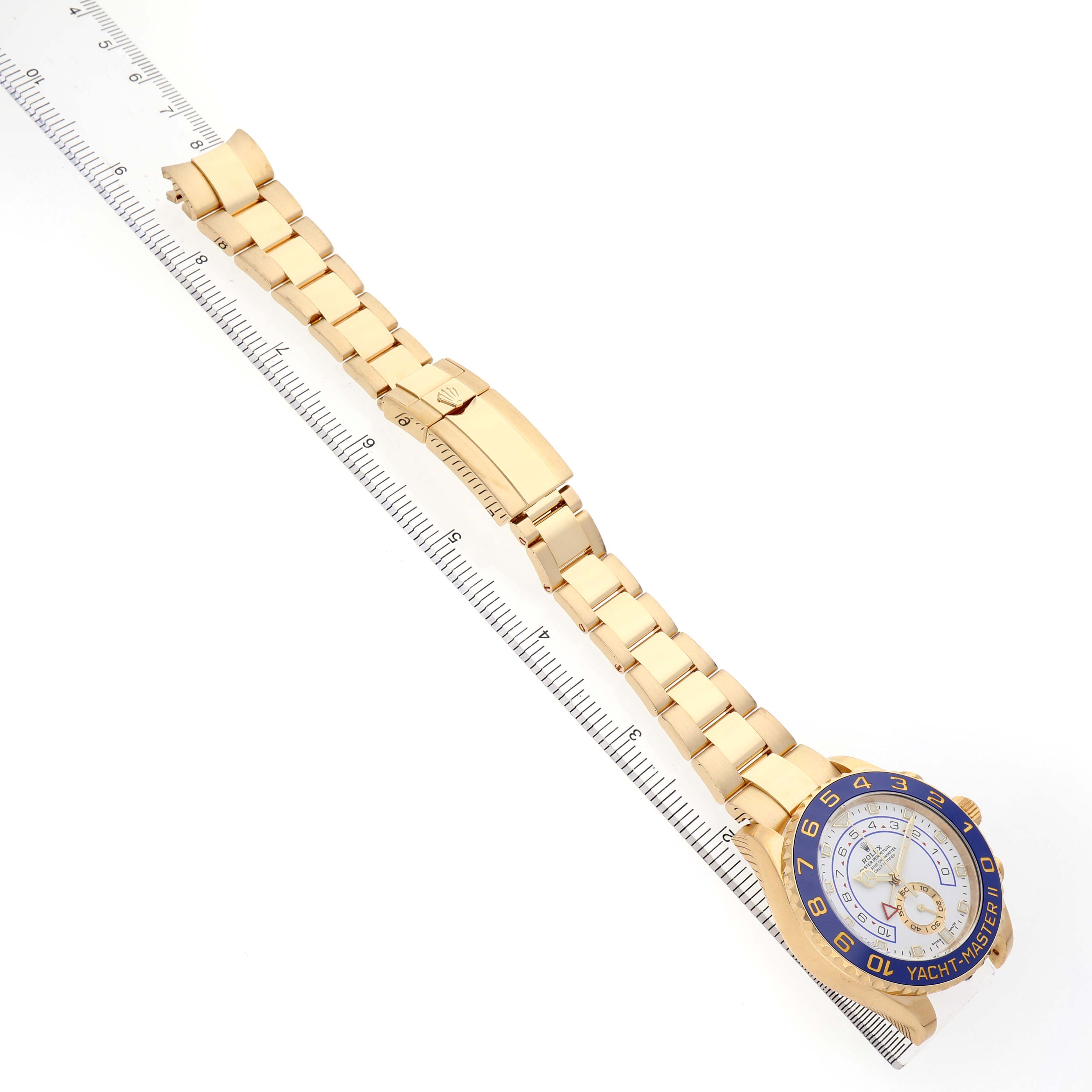 The Rolex Yacht-Master 116688 Men's Yellow Gold White Dial watch is shown at an angle, displaying the full bracelet, clasp, and face.