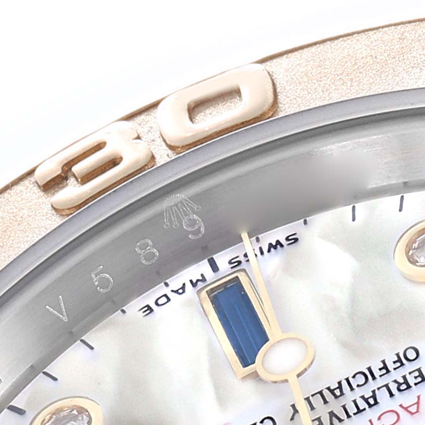 The image shows a close-up of the bezel and dial of a Rolex Yacht-Master 16623 Men
s Steel and Gold (two tone) Mother of Pearl Dial watch, highlighting the "30" marker and part of the dial.