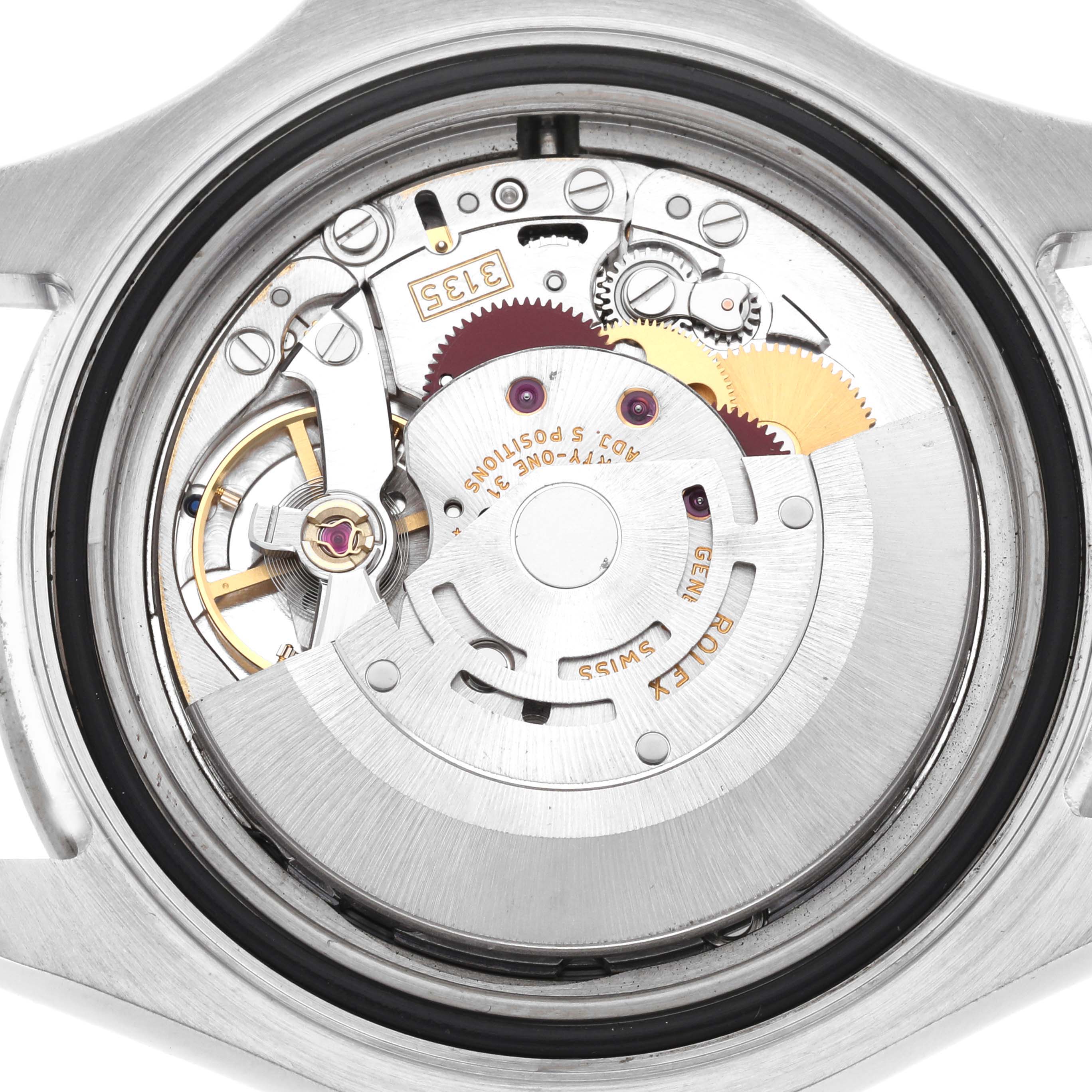 The image shows the internal mechanism of a Rolex Yacht-Master 16622 Men
s Stainless Steel Silver Dial watch from a back view, highlighting gears and components.