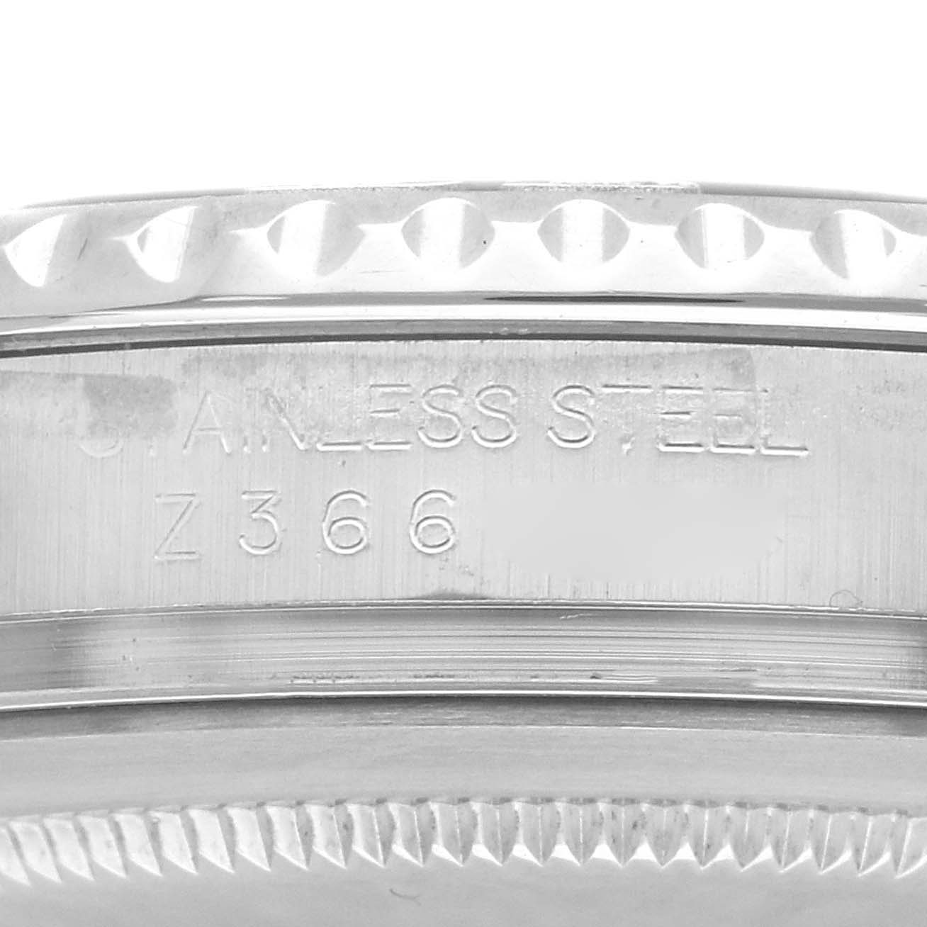 The image shows a close-up of the Rolex Yacht-Master 16622 Men
s Stainless Steel Silver Dial watch
s stainless steel side with engraving details.