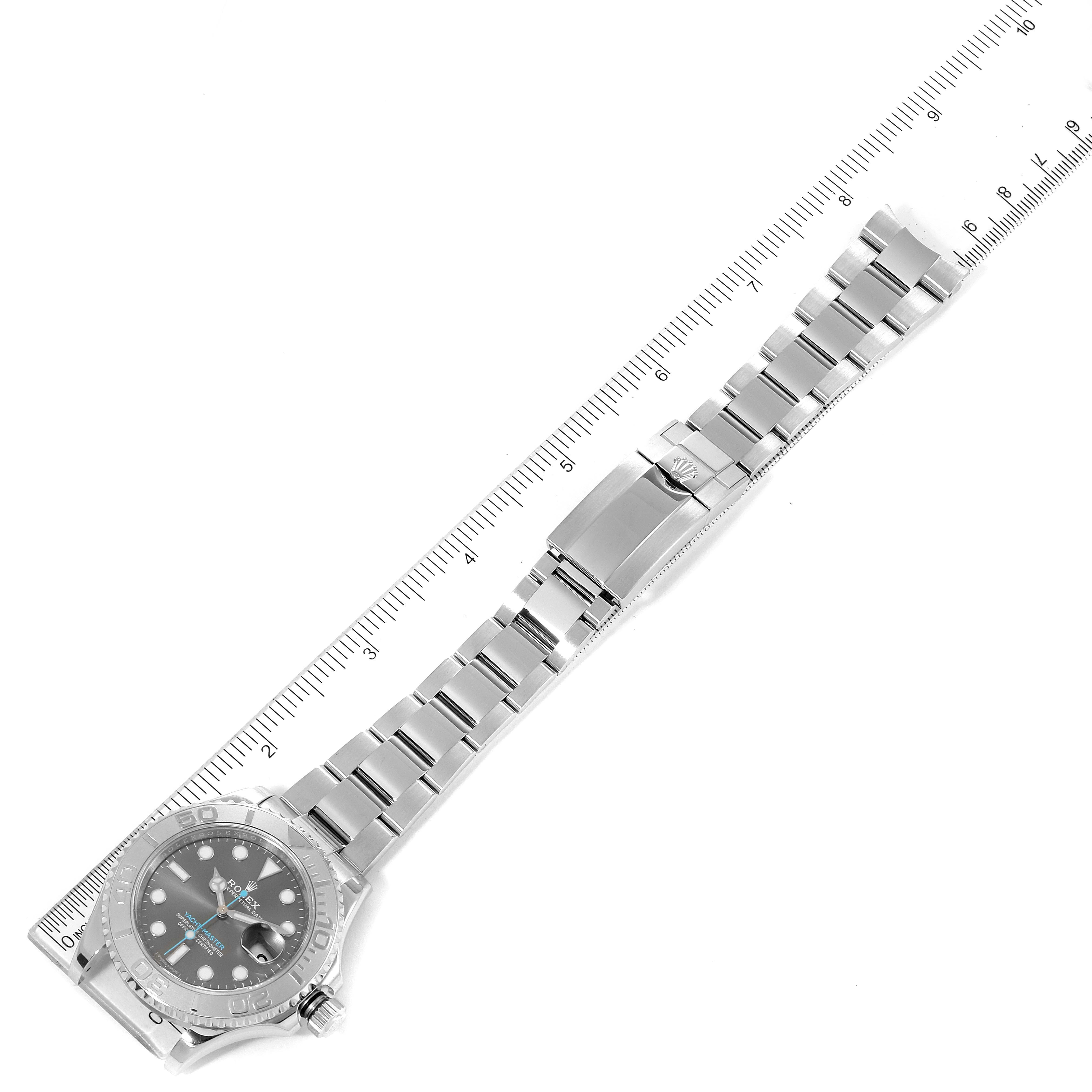 The Rolex Yacht-Master 116622 Men
s Stainless Steel Grey Dial 116622 Men
s Stainless Steel Grey Dial watch is shown laid flat with its face and full bracelet visible, alongside a ruler for size reference.