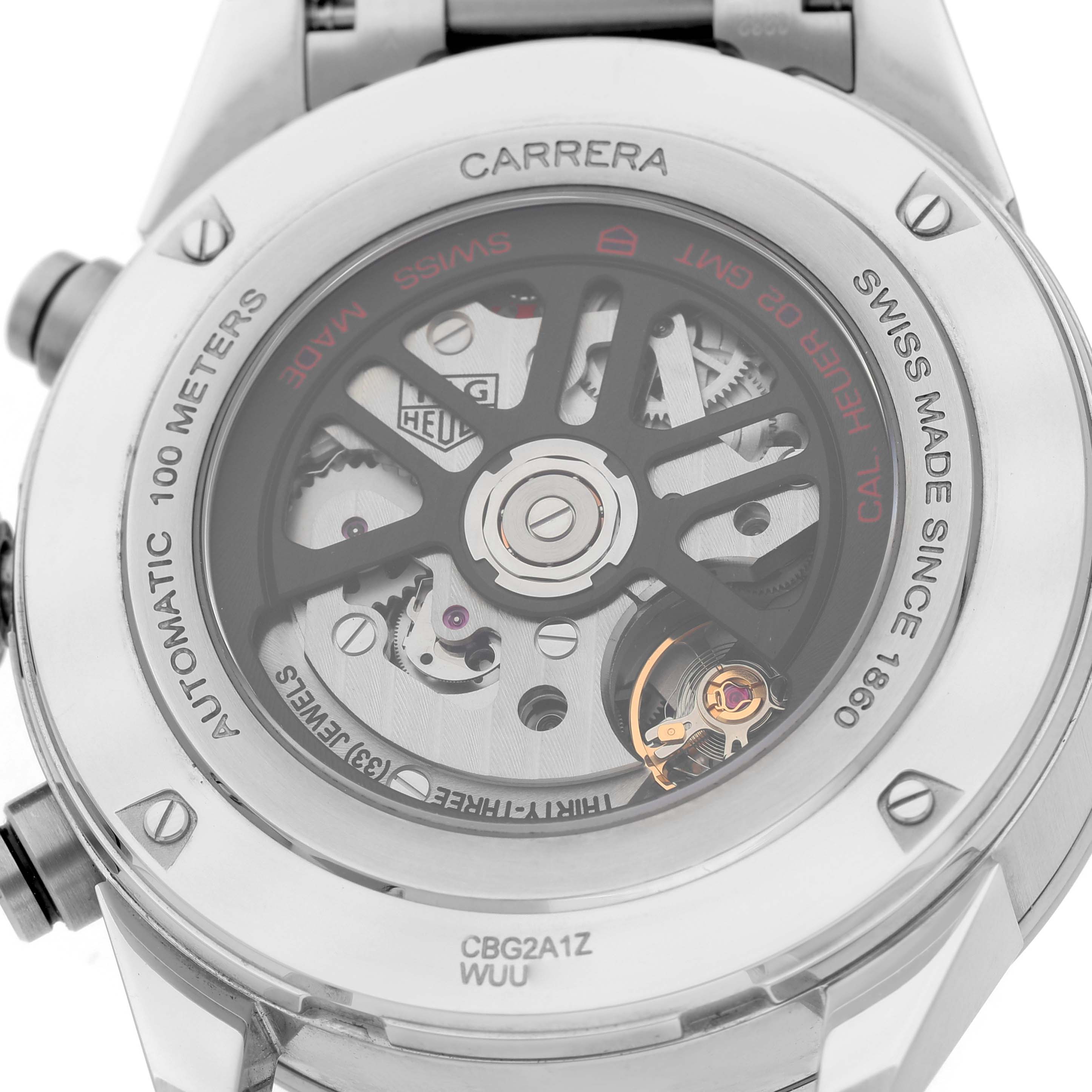 The image shows the back view of a Tag Heuer Carrera CBG2A1Z Men's Stainless Steel Black Dial watch, highlighting its transparent case back and inner mechanical parts.