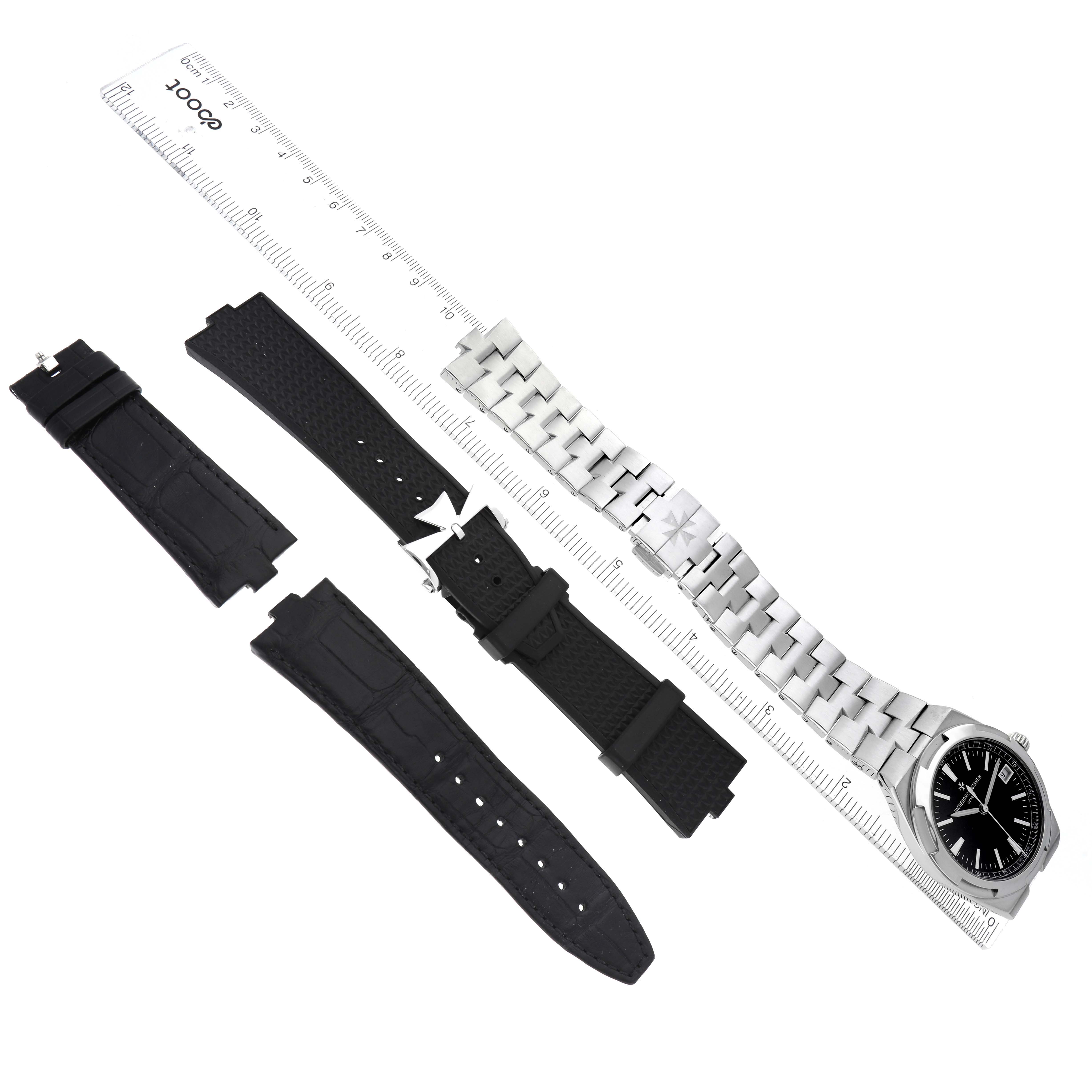 The Vacheron Constantin Overseas 4500V Men
s Stainless Steel Black Dial watch is shown from the top, featuring its face, metal bracelet, and additional black straps.