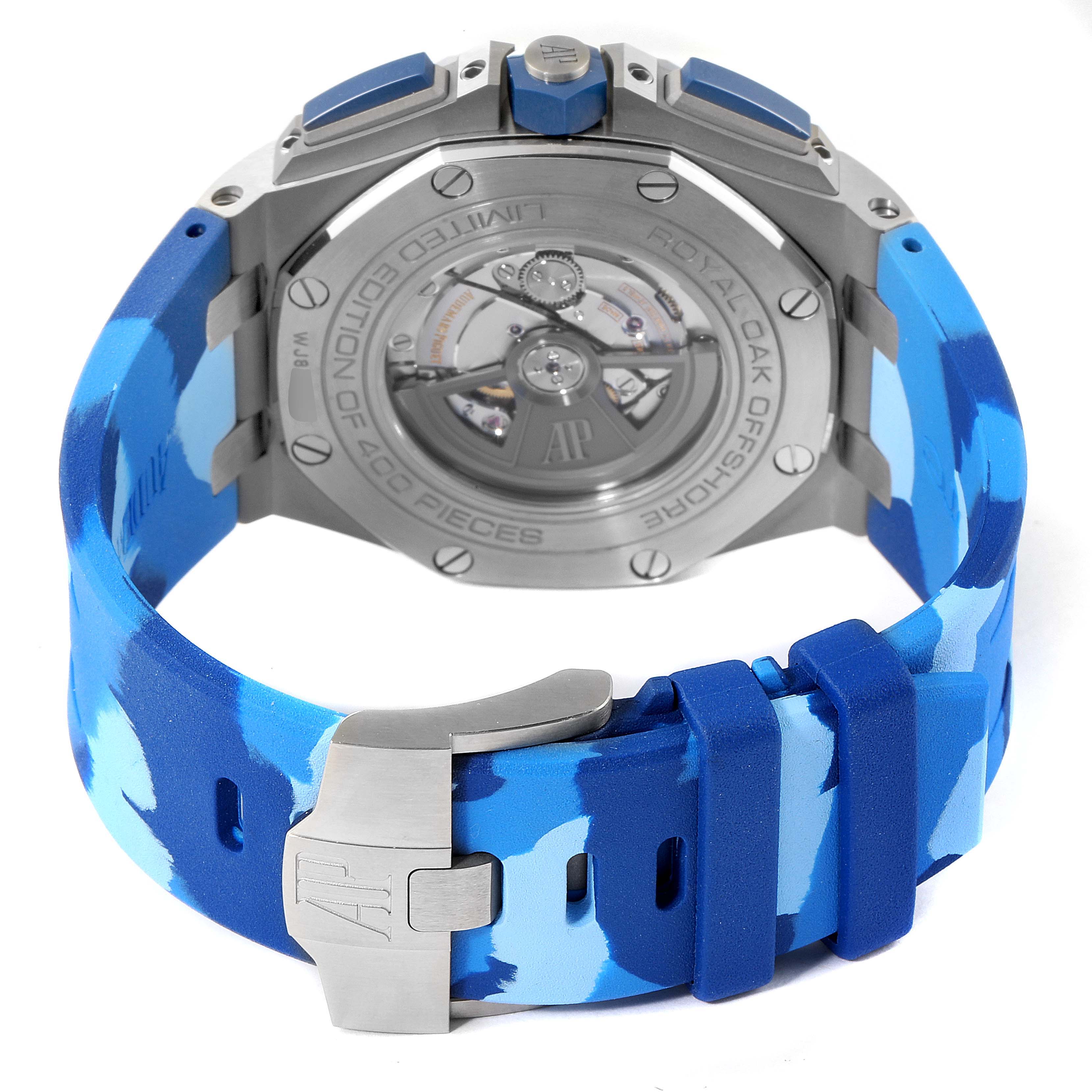 The image shows the back view of an Audemars Piguet Royal Oak Offshore 26400SO.OO.A335CA.01 Men's Stainless Steel Blue Dial 26400SO.OO.A335CA.01 Men's Stainless Steel Blue Dial watch with a blue camo strap and open case back.